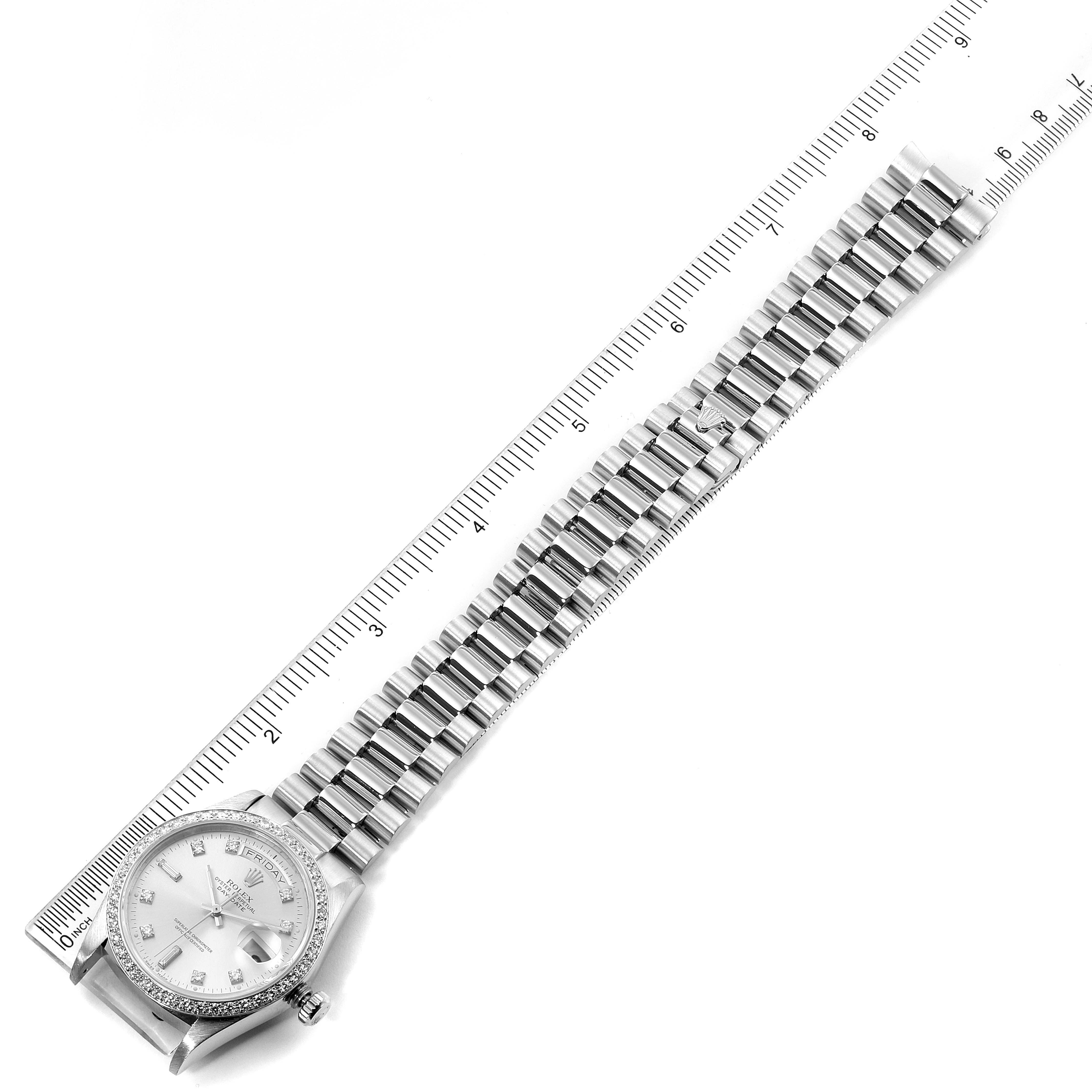 The image shows a top-down view of a Rolex President 18046 Men's Platinum Silver Dial 18046 Men's Platinum Silver Dial model watch placed alongside a ruler, highlighting the watch band and face.