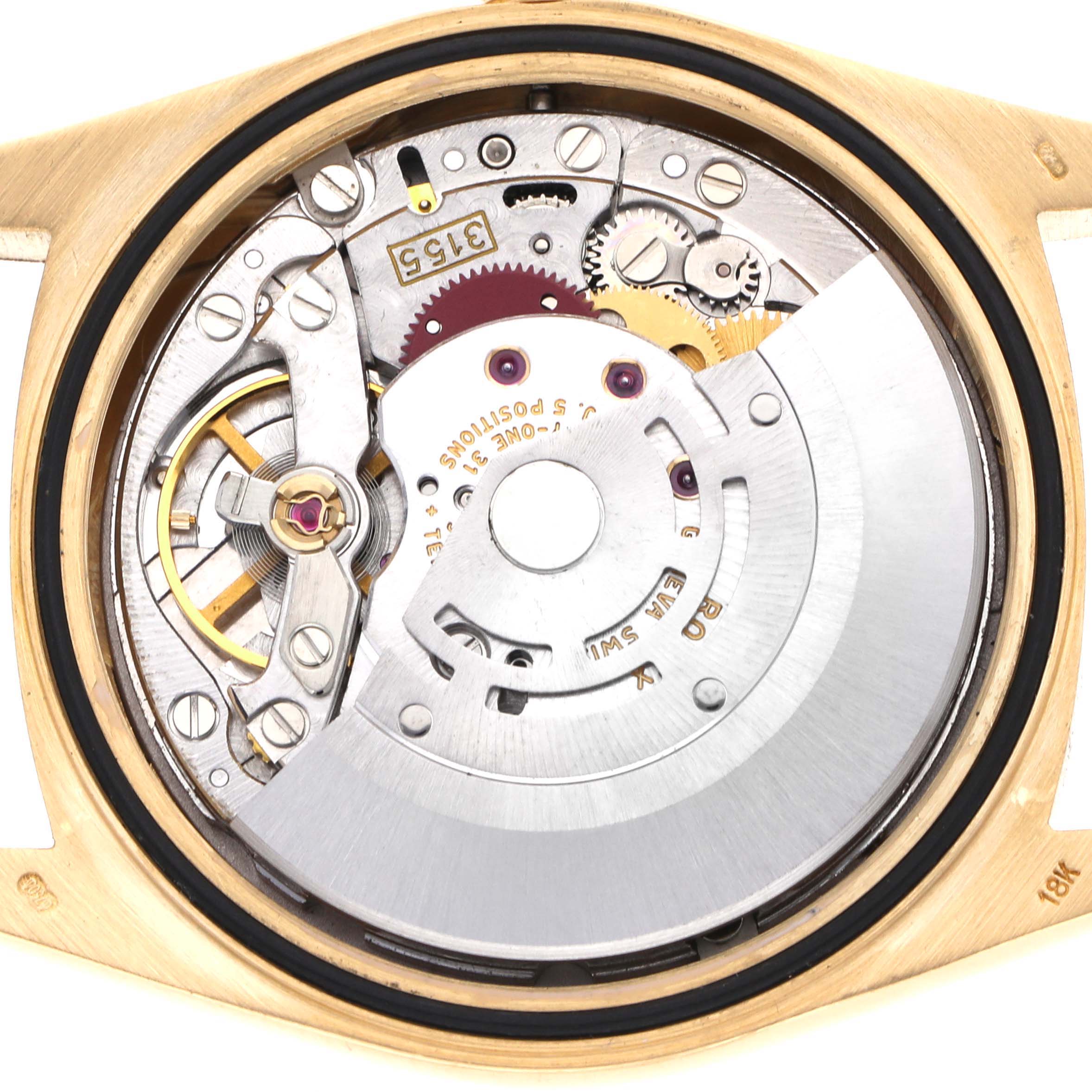 The image shows the internal mechanism of a Rolex President 18248 Men's Yellow Gold Champagne Dial watch from a top-down angle, highlighting the movement components.