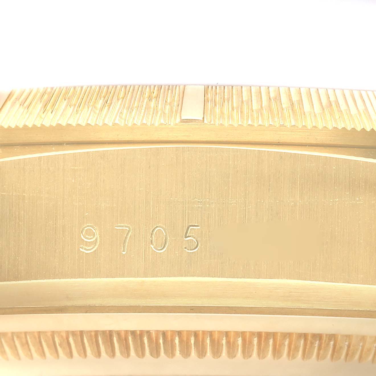 The image shows the side engraving of the Rolex President 18078 Men
s Yellow Gold Champagne Dial 18078 Men
s Yellow Gold Champagne Dial model, highlighting the serial number.