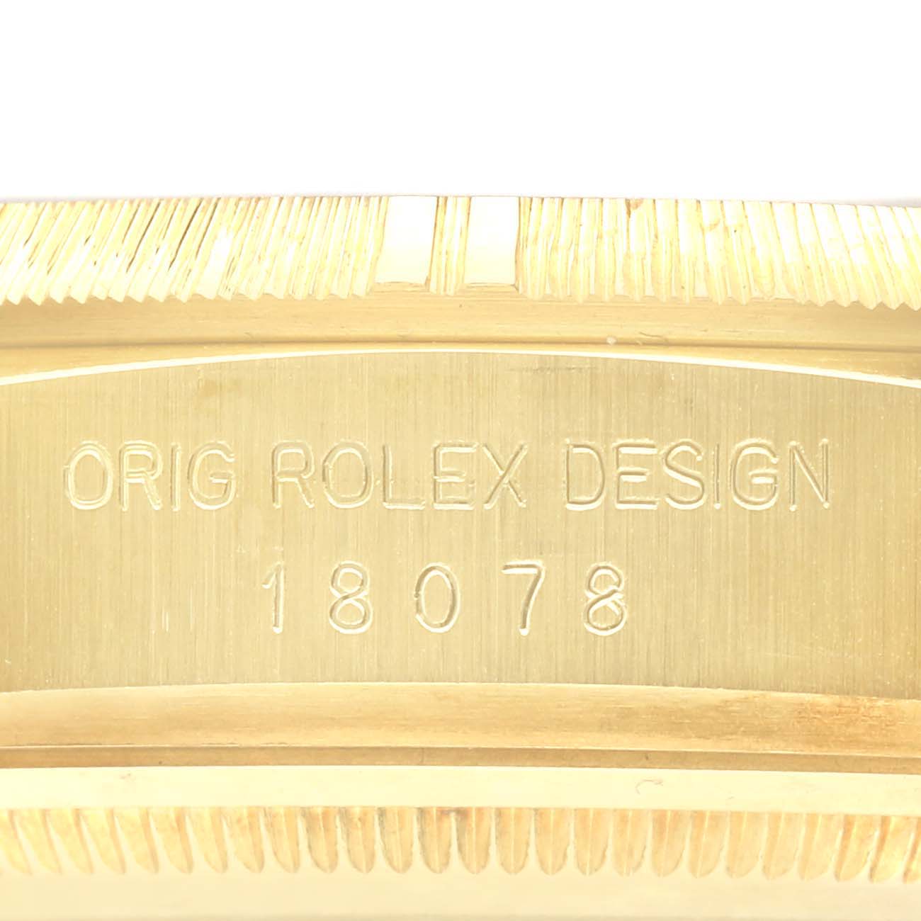 The image shows the side engraving on the case of a Rolex President 18078 Men
s Yellow Gold Champagne Dial 18078 Men
s Yellow Gold Champagne Dial model, featuring its design number.