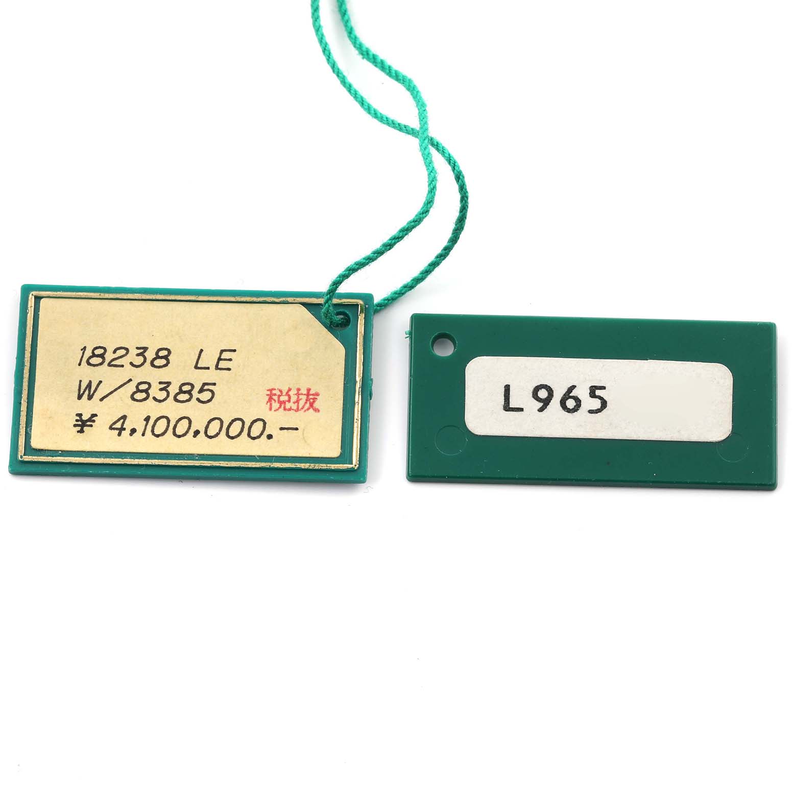 The image shows two green tags related to a Rolex Datejust, displaying model and pricing information.