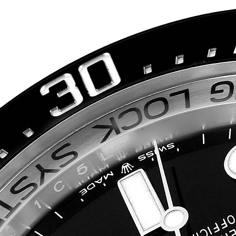 Close-up shot of the bezel and dial of a Rolex Sea-Dweller 136660 Men
s Stainless Steel Black Dial 136660 Men
s Stainless Steel Black Dial watch, showing minute markers and part of the "30" indicator.