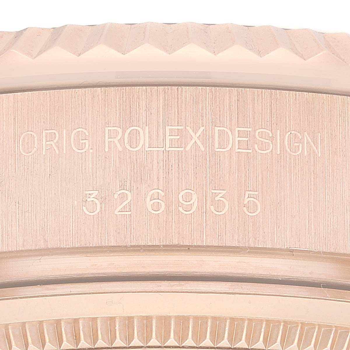 The image shows the model number and partial case back of a Rolex Sky-Dweller 326935 Men's Rose Gold Pink Dial 326935 Men's Rose Gold Pink Dial watch, focusing on the engraved details.