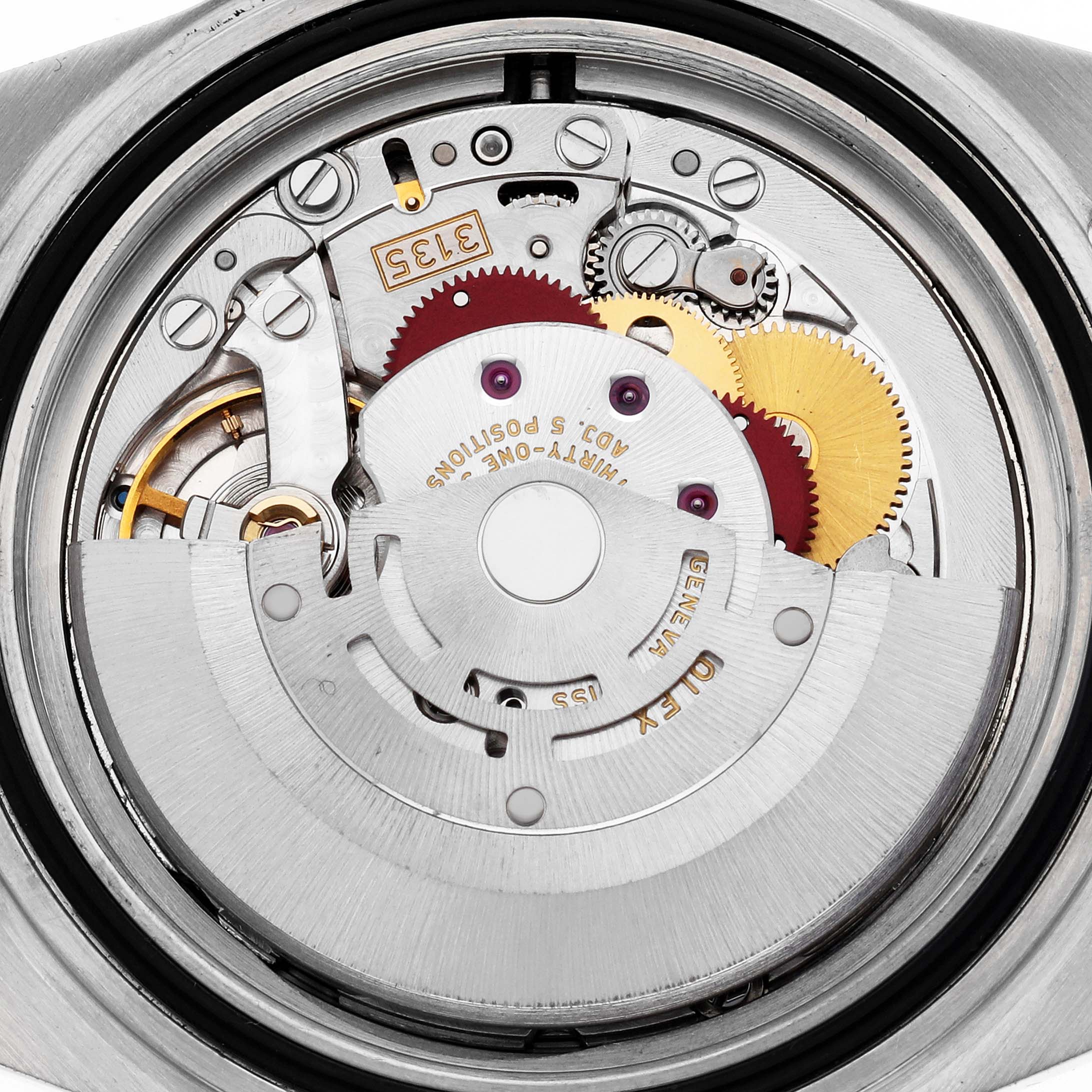 The image shows the back of a Rolex Submariner 16610 Men's Stainless Steel Black Dial, highlighting its intricate movement and internal mechanics.