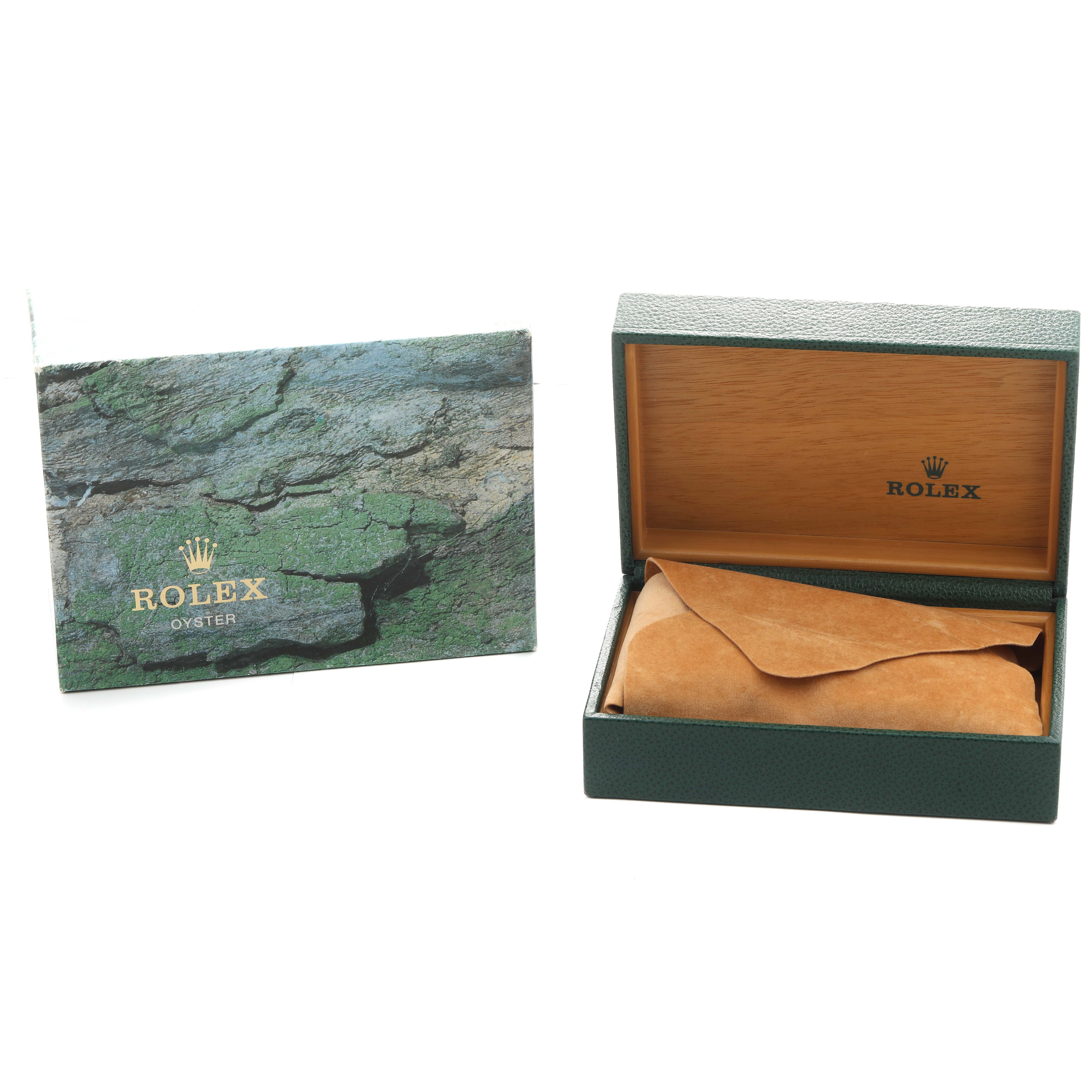 The image shows a Rolex Submariner 16610 Men's Stainless Steel Black Dial box and outer packaging, with the box lid open and a brown suede covering inside.