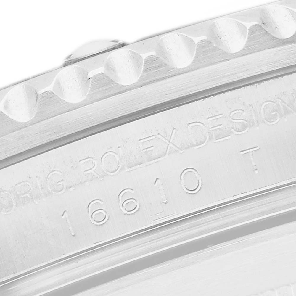 The image shows a close-up of the engraved bezel and edge of a Rolex Submariner 16610 Men's Stainless Steel Black Dial watch, displaying part of the model number.