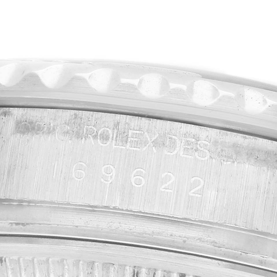 The image shows a close-up of the engraved edge on the Rolex Yacht-Master 169622 Women's Stainless Steel Silver Dial, showcasing its serial number.