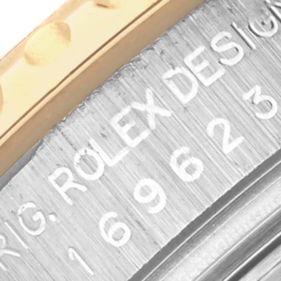 The image shows a close-up of the side of a Rolex Yacht-Master 169623 Women
s Steel and Gold (two tone) White Dial 169623 Women
s Steel and Gold (two tone) White Dial watch, featuring the engraved brand and model details.