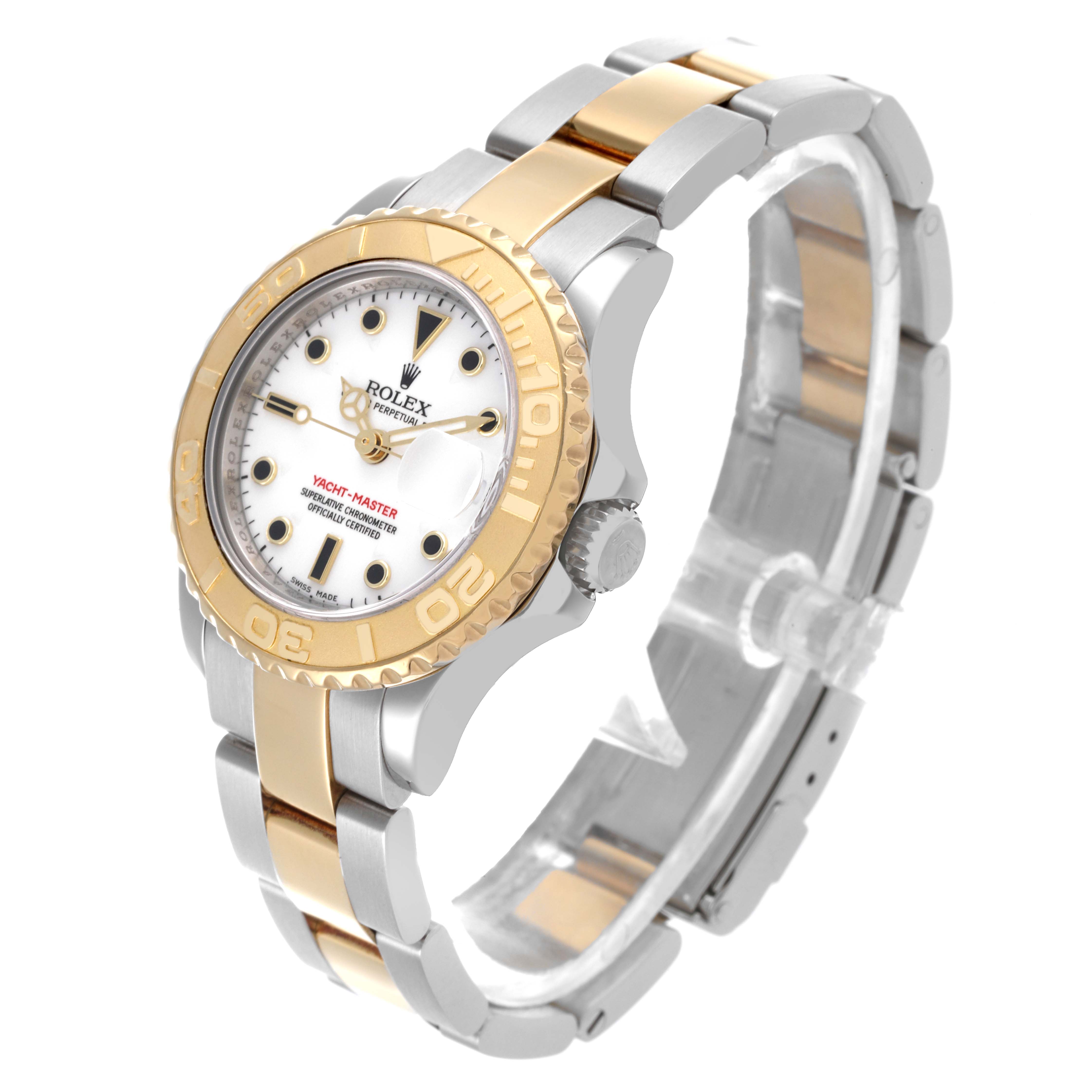The Rolex Yacht-Master 169623 Women
s Steel and Gold (two tone) White Dial 169623 Women
s Steel and Gold (two tone) White Dial watch is shown at a three-quarter angle, highlighting the bezel, dial, and bracelet.