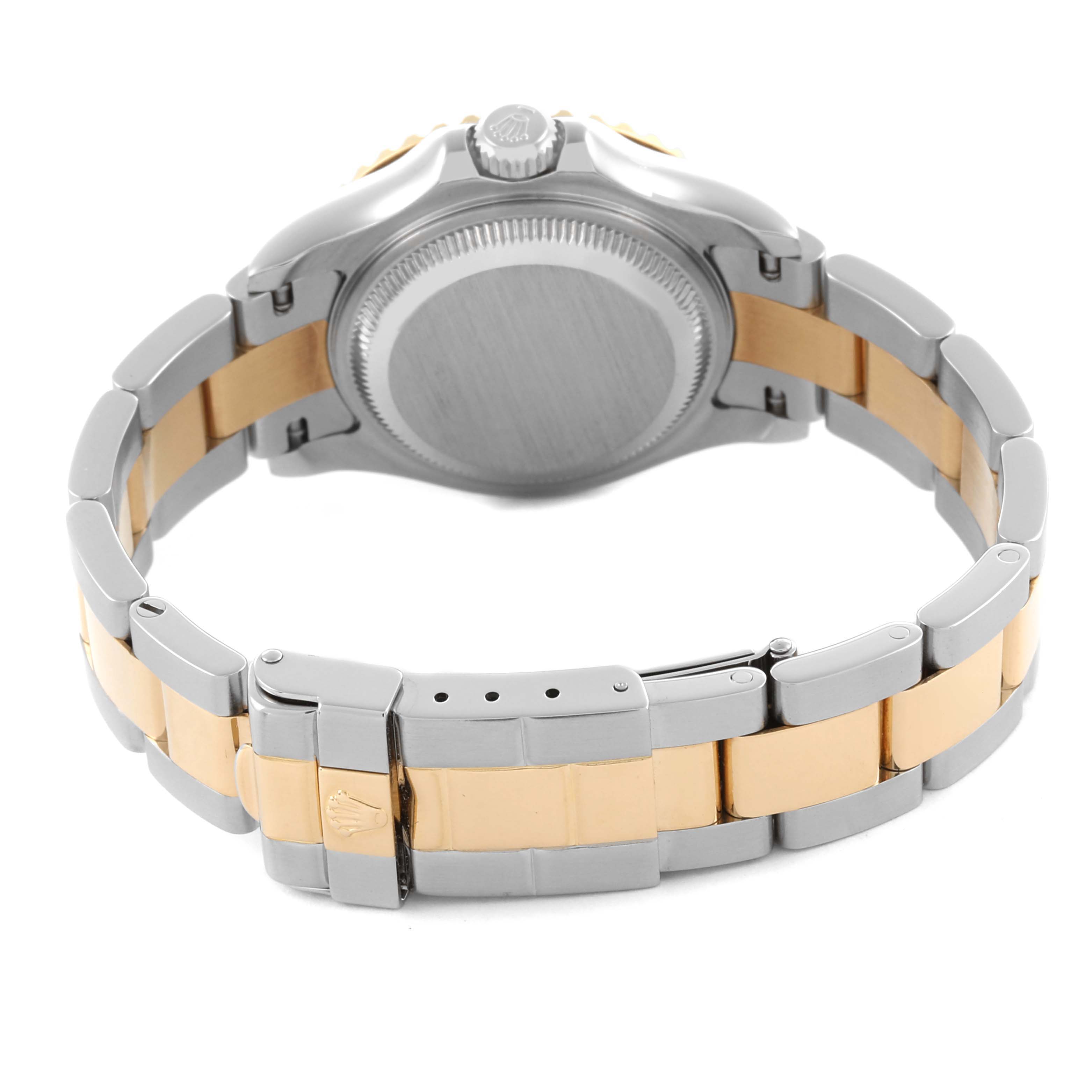 The image shows the back and bracelet of a Rolex Yacht-Master 169623 Women
s Steel and Gold (two tone) White Dial 169623 Women
s Steel and Gold (two tone) White Dial watch, highlighting the clasp and two-tone metal design.