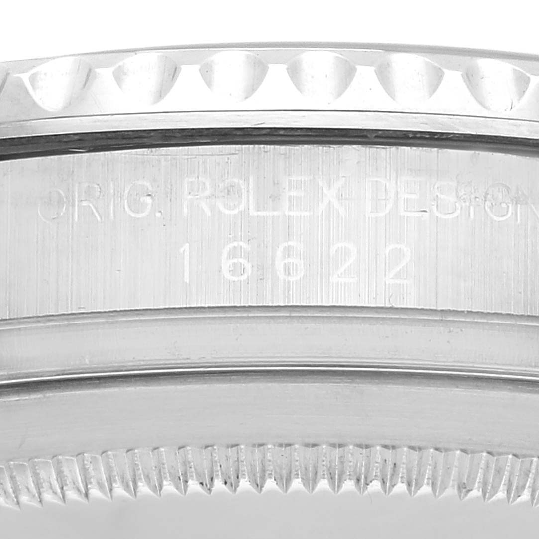 This is a close-up angle of the Rolex Yacht-Master 16622 Men's Stainless Steel Silver Dial 16622 Men's Stainless Steel Silver Dial watch case showing the model number 16622 and the "ORIG. ROLEX DESIGN" engraving.