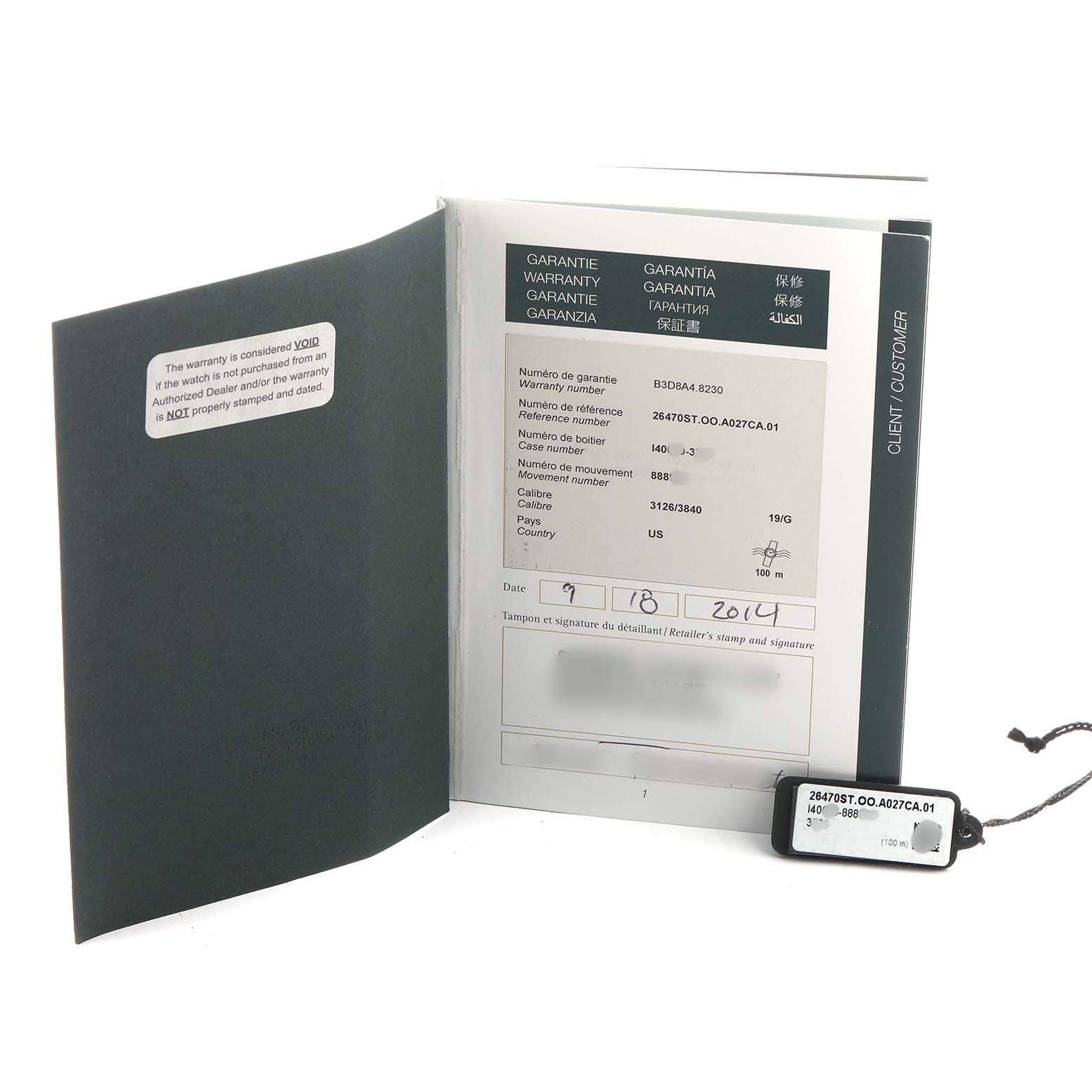 The image shows the warranty book and tag for the Audemars Piguet Royal Oak Offshore 26470ST.OO.A027CA.01 Men's Stainless Steel Blue Dial model, displayed at an angle.