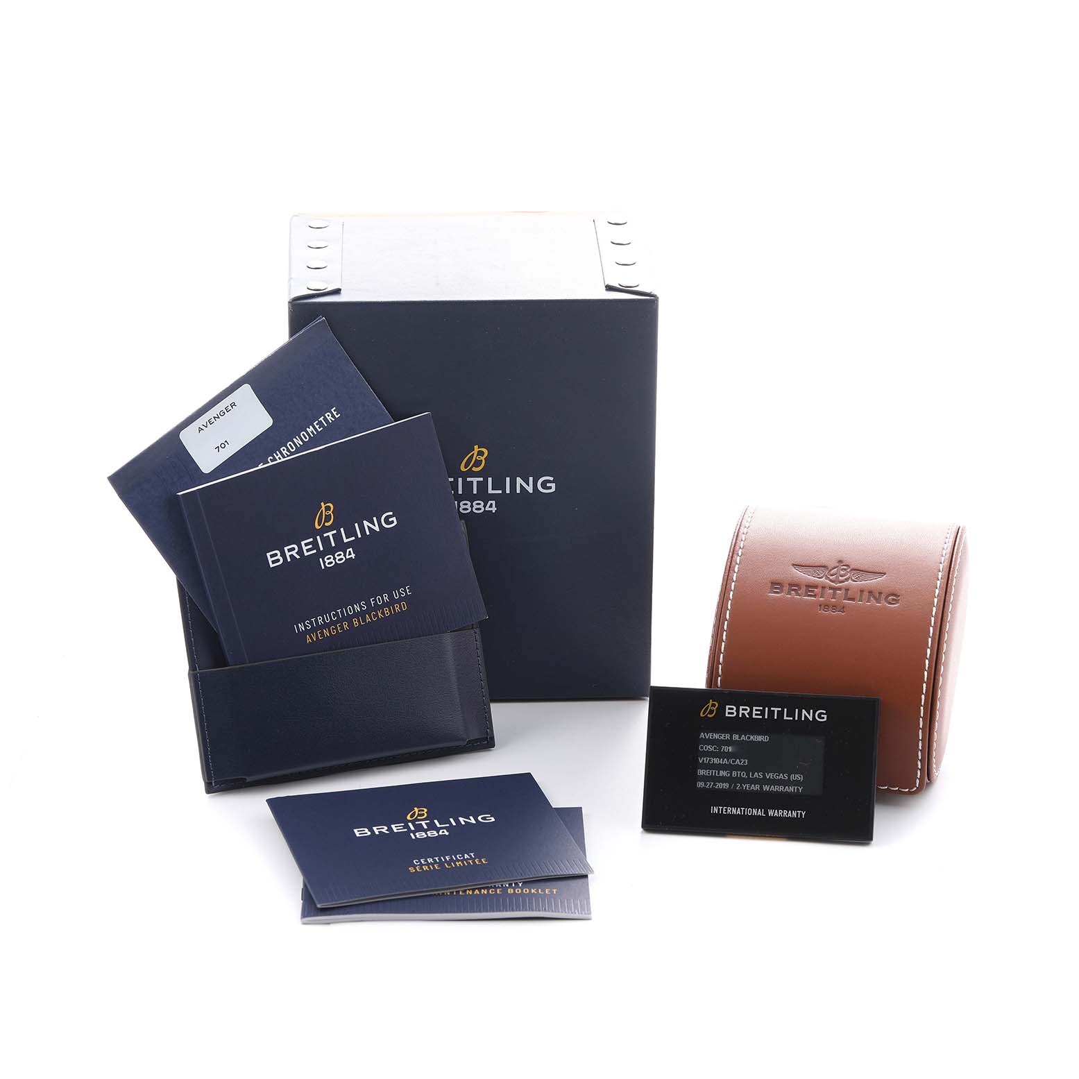 The image shows Breitling Avenger V17310A/CA23 Men's Titanium Blue Dial watch packaging, including a box, leather case, manuals, and a warranty card.