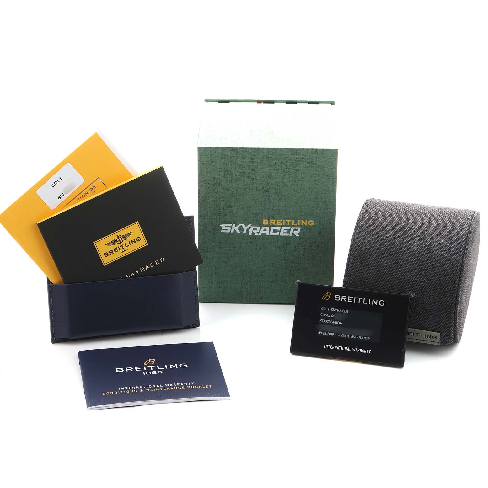 The image shows the Breitling Colt X74320E4/BF87 Men's Titanium Black Dial watch's box, manuals, warranty card, and a watch cushion from a front angle.