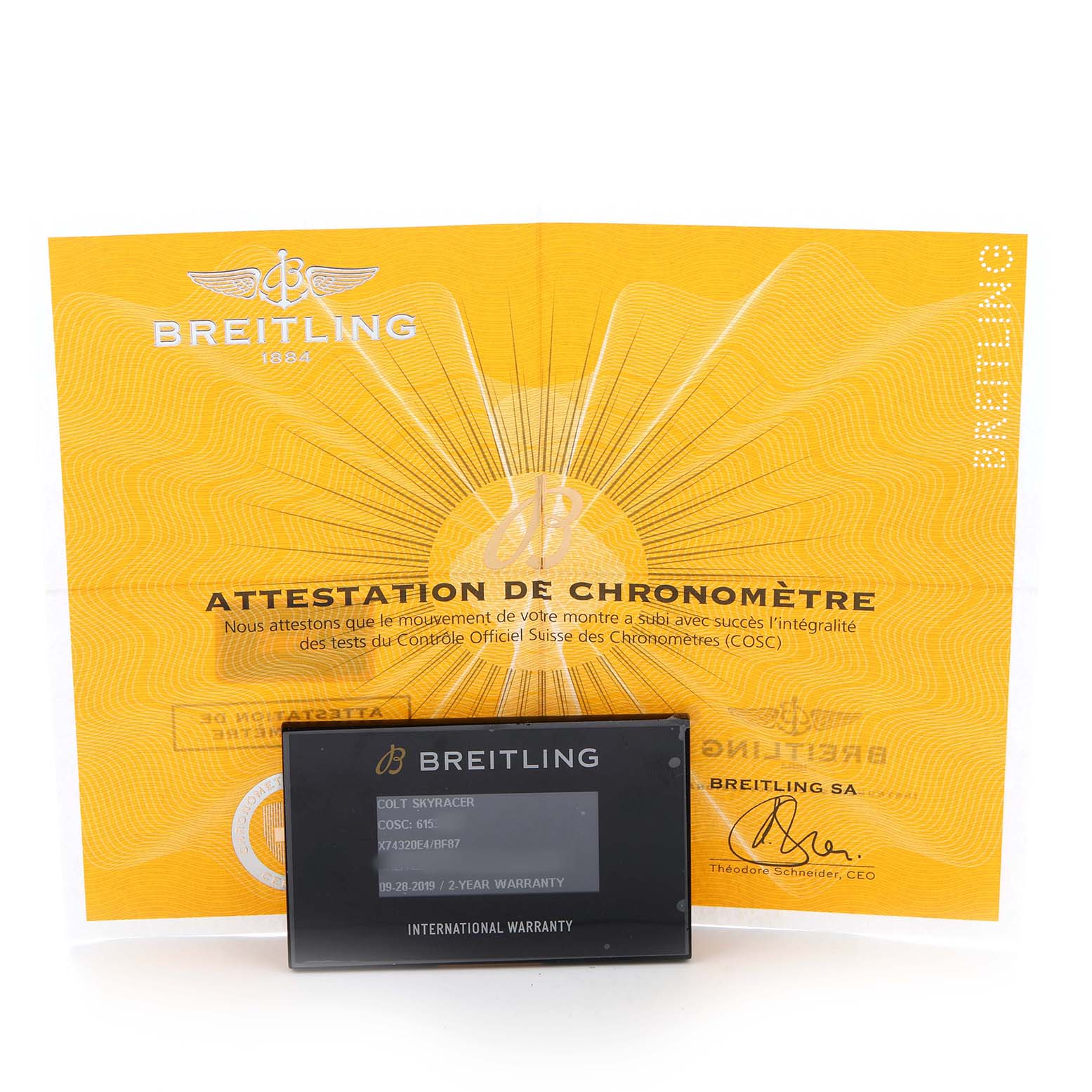 The image shows a Breitling Colt X74320E4/BF87 Men's Titanium Black Dial model warranty card and a certification document, viewed from the front.
