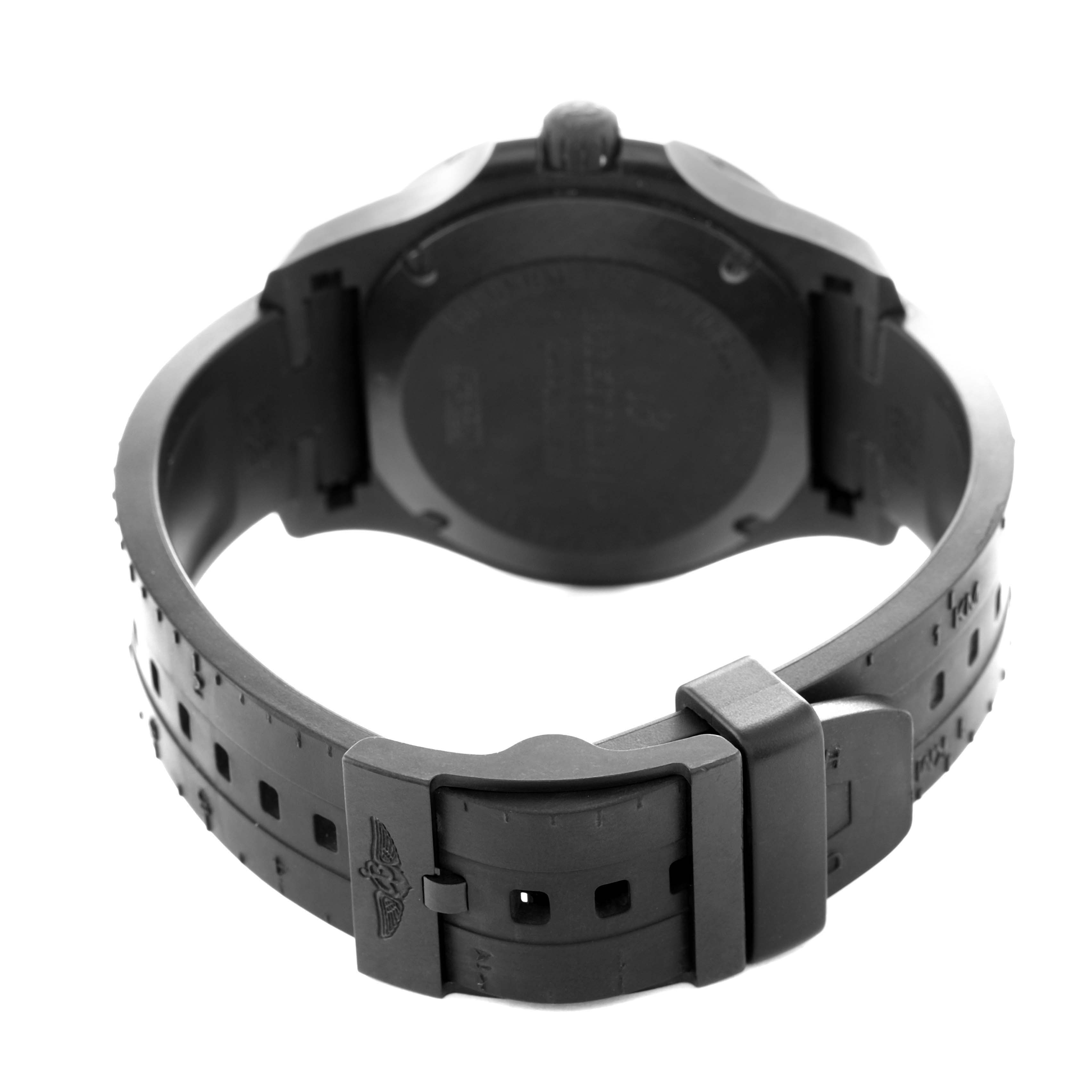 The image shows the back and clasp of a Breitling Colt X74320E4/BF87 Men's Titanium Black Dial watch, highlighting its black strap and buckle with the logo.