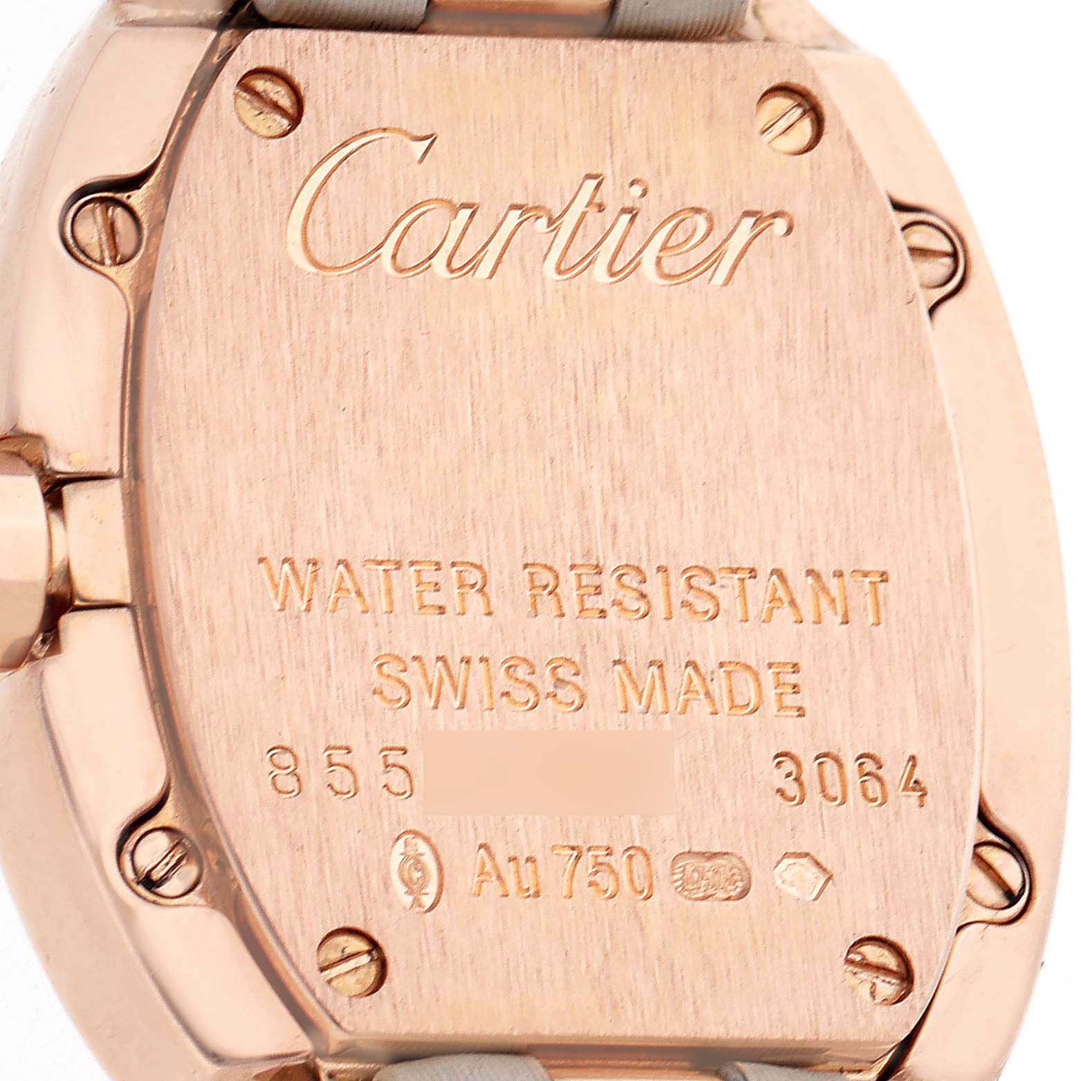 The image shows the back case of a Cartier Baignoire WB520004 Women's Rose Gold Silver Dial watch, featuring screws and engraved details.