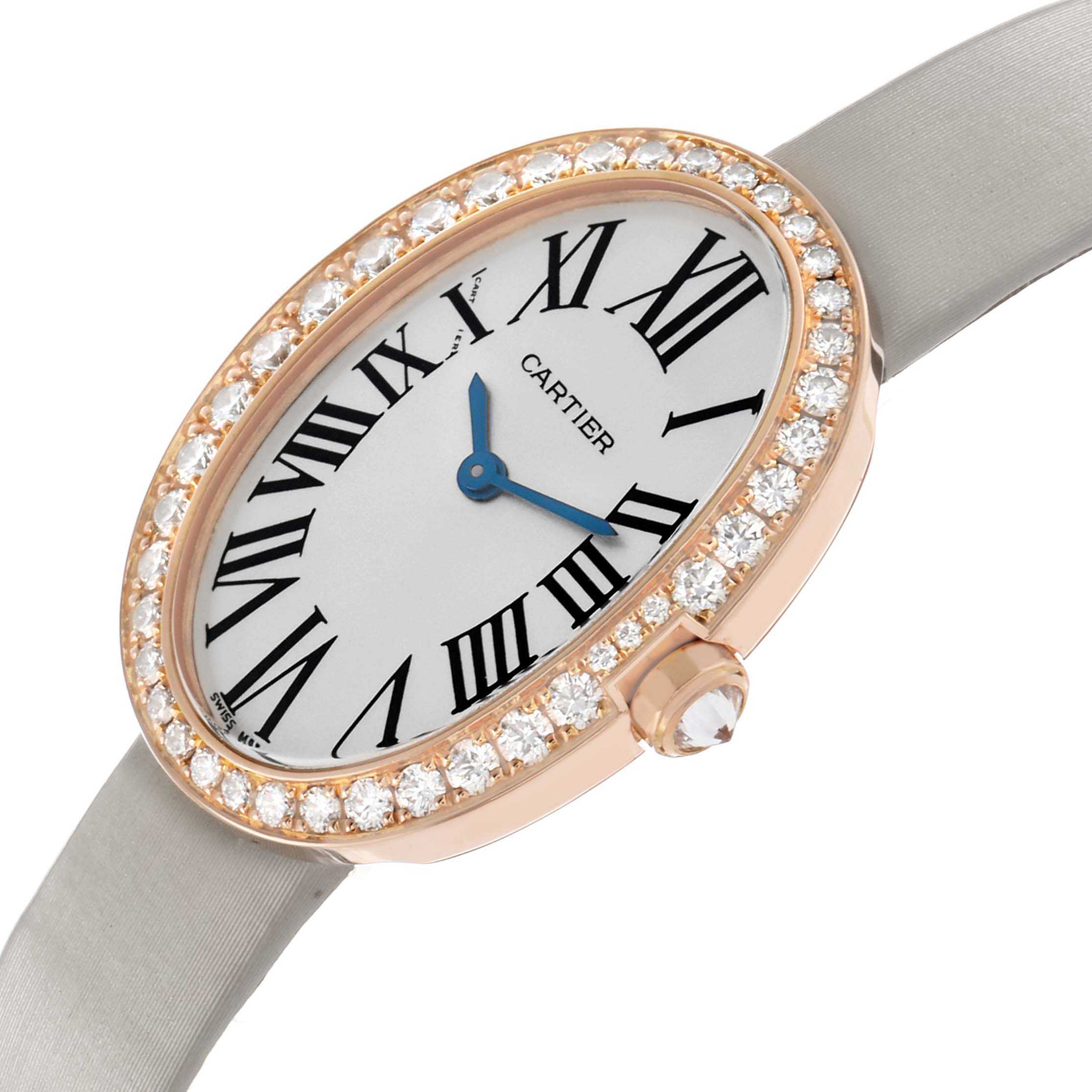 The Cartier Baignoire WB520004 Women's Rose Gold Silver Dial watch is shown at an angle displaying its oval face, diamond bezel, Roman numerals, and blue hands.
