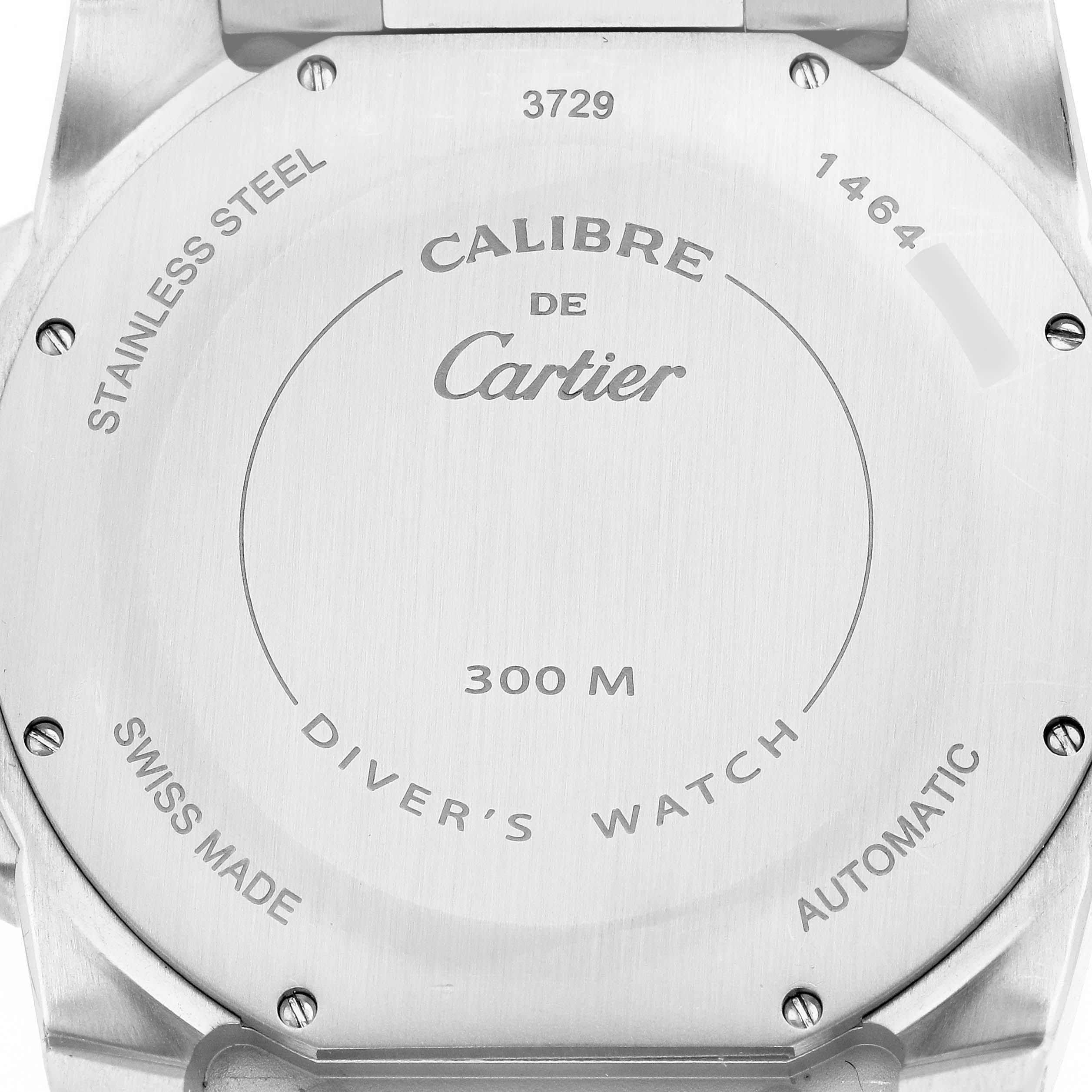 The image shows the back case of a Calibre de Cartier watch by Cartier, highlighting the stainless steel design.