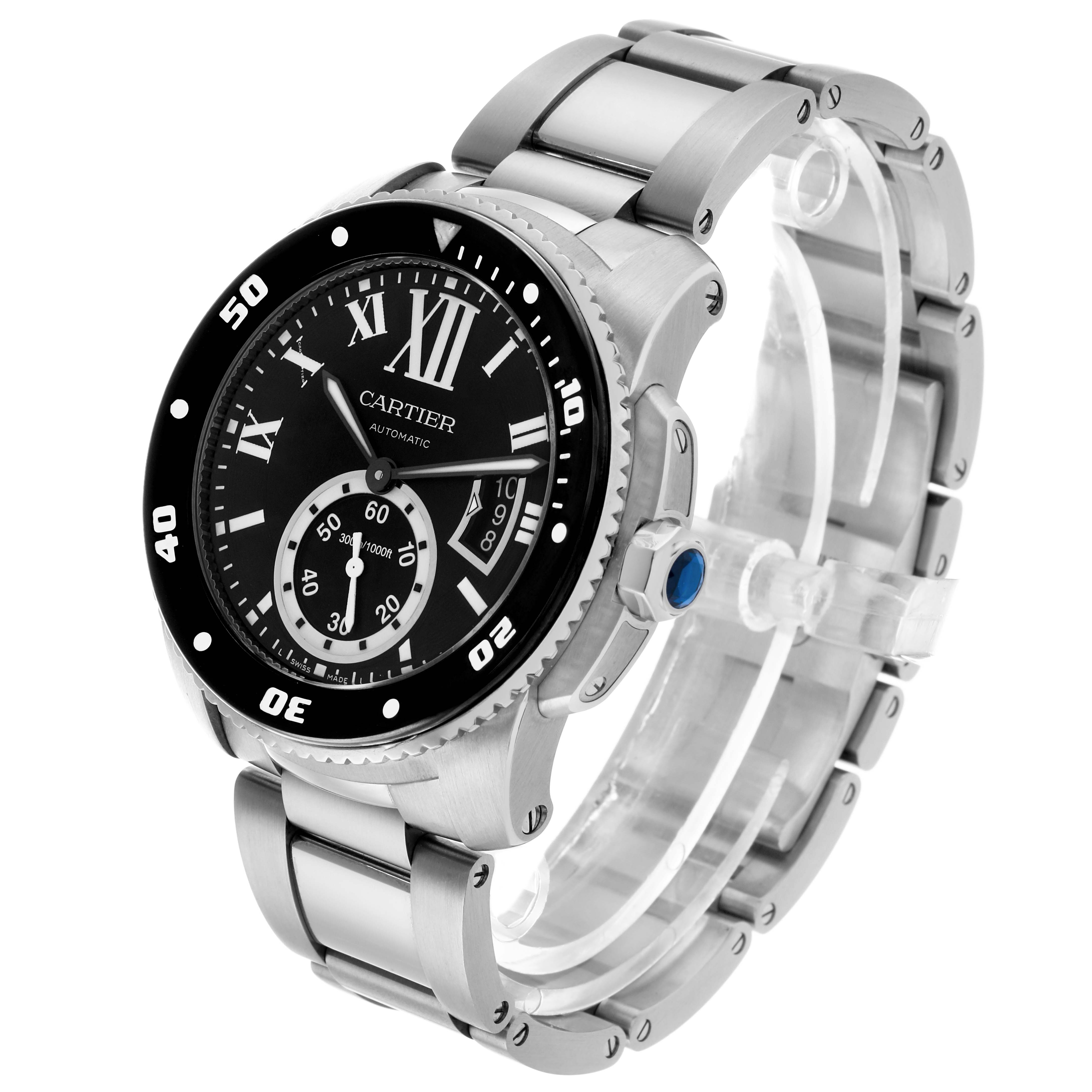 The Calibre de Cartier watch is shown at a three-quarter angle, highlighting the face, bezel, crown, and metal bracelet.