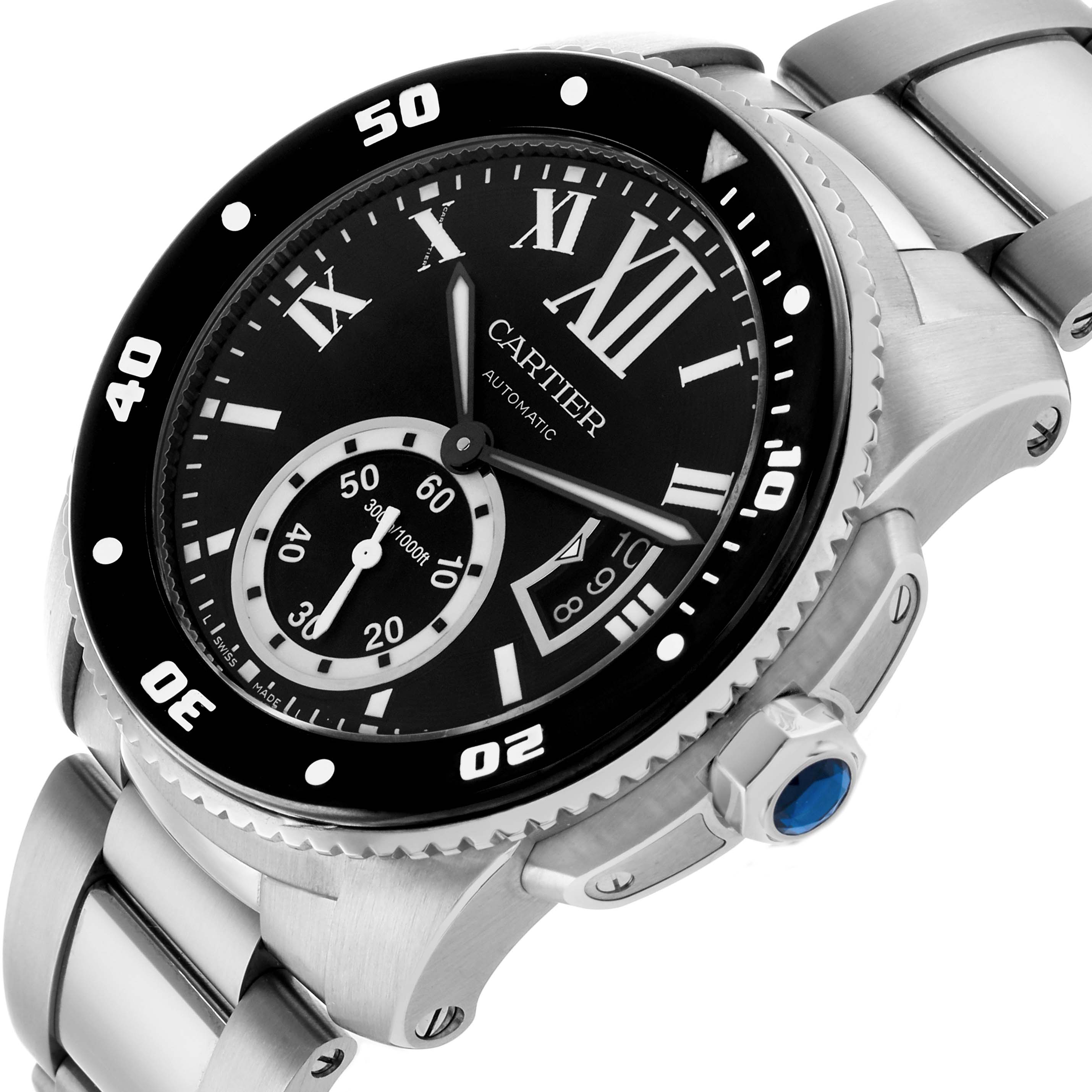 The Calibre de Cartier watch is shown at a three-quarter angle, highlighting the dial, bezel, and stainless steel bracelet.