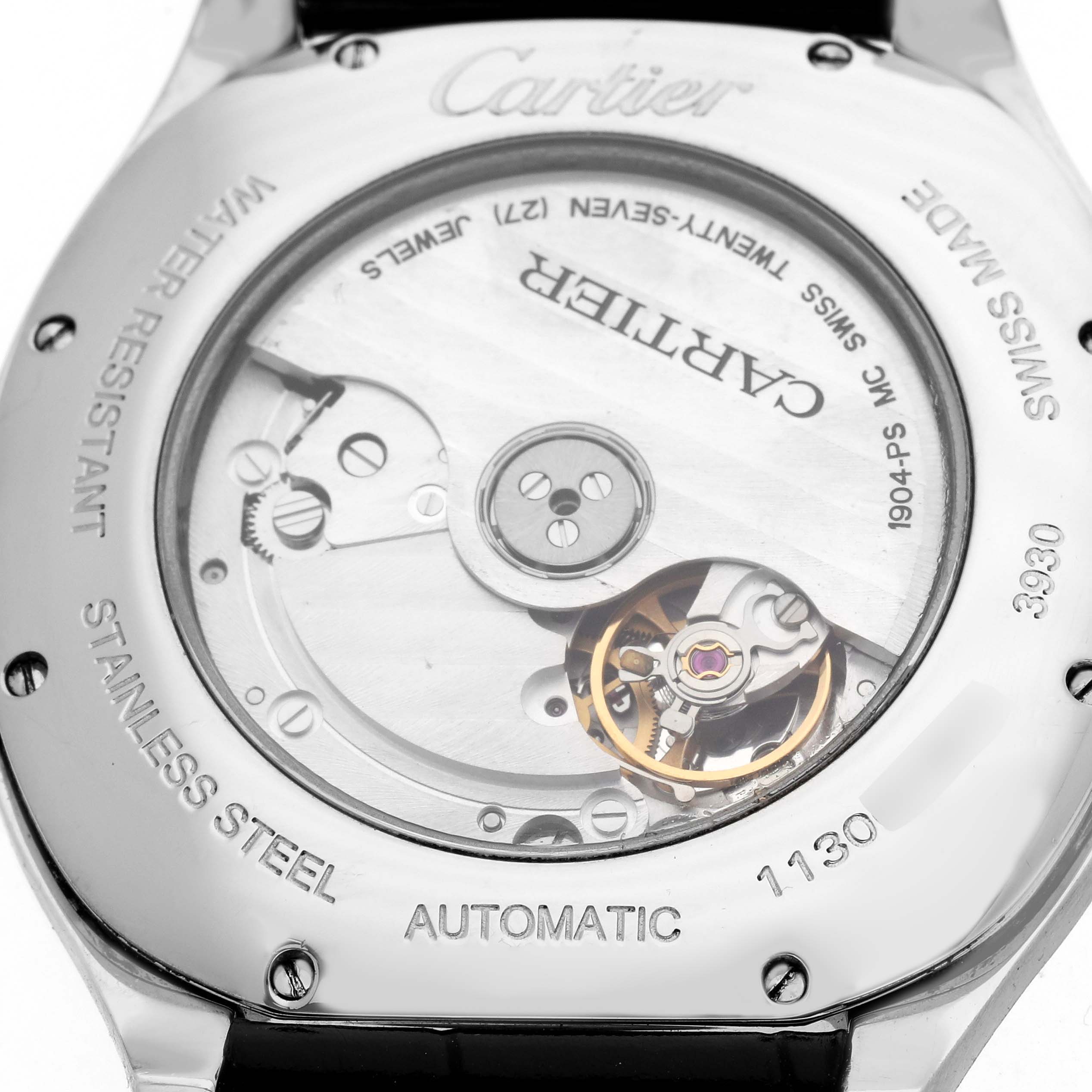 The image shows the back of the Drive de Cartier watch, highlighting its automatic movement and stainless steel casing.