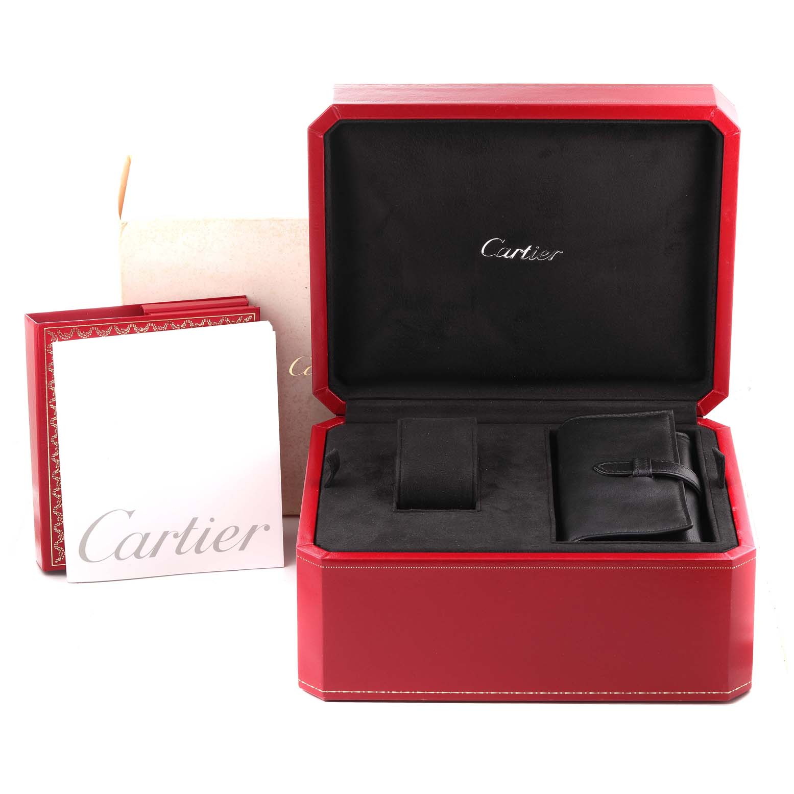 The image shows the packaging for a Cartier Roadster W62020X6 Men's Stainless Steel Black Dial W62020X6 Men's Stainless Steel Black Dial watch, including the red display box, a leather pouch, and accompanying booklets.