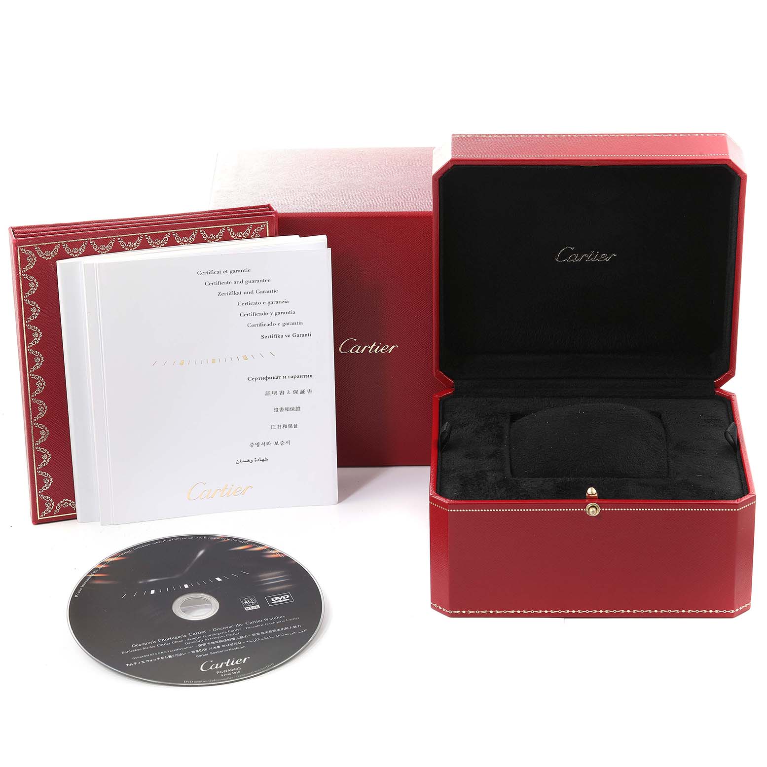 The image shows the Tank Americaine watch accessories by Cartier, including a red box, papers, and a DVD from a front angle.