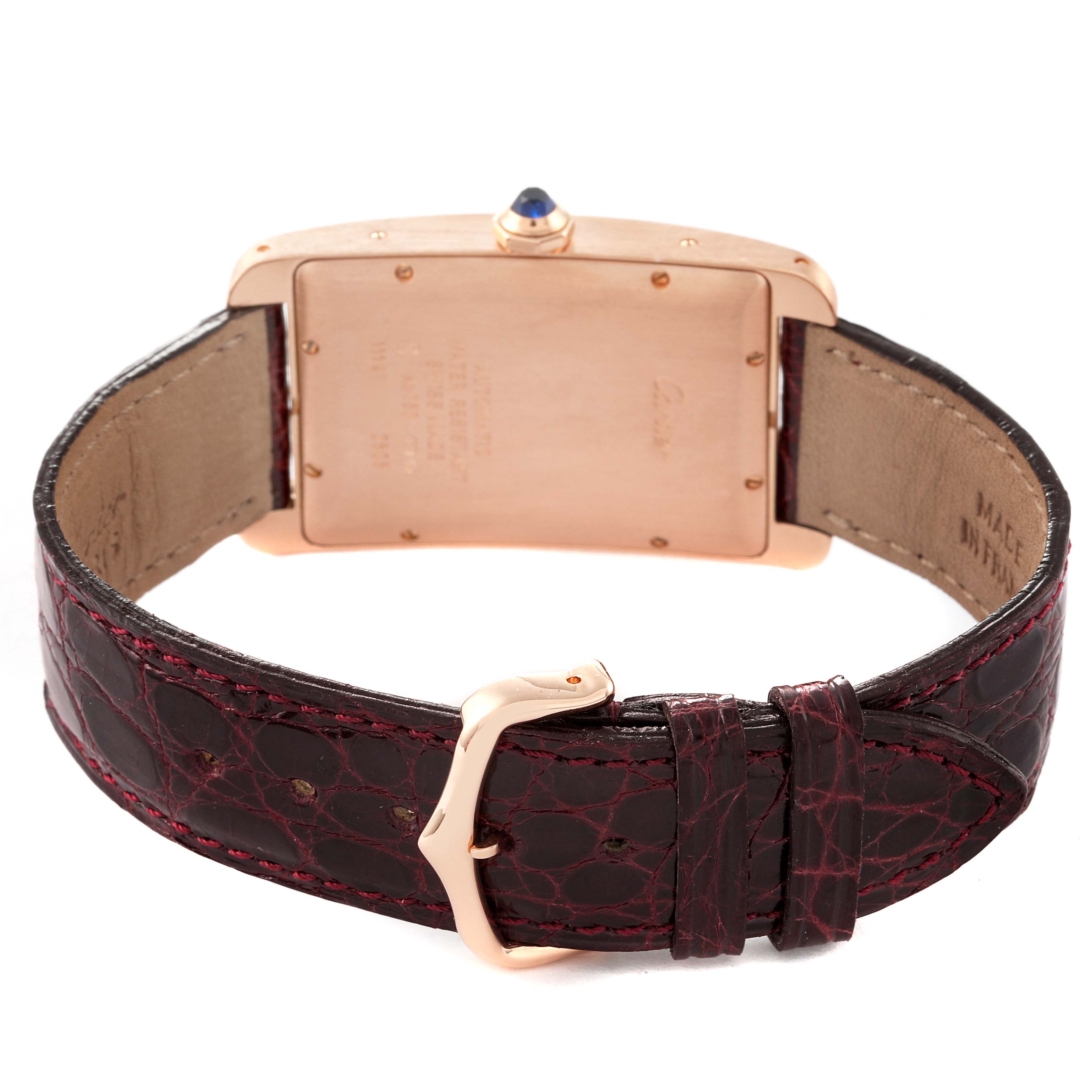 The image shows the back view of a Cartier Tank Americaine W2609156 Men
s Rose Gold Silver Dial W2609156 Men
s Rose Gold Silver Dial watch, highlighting the case back, leather strap, and buckle.