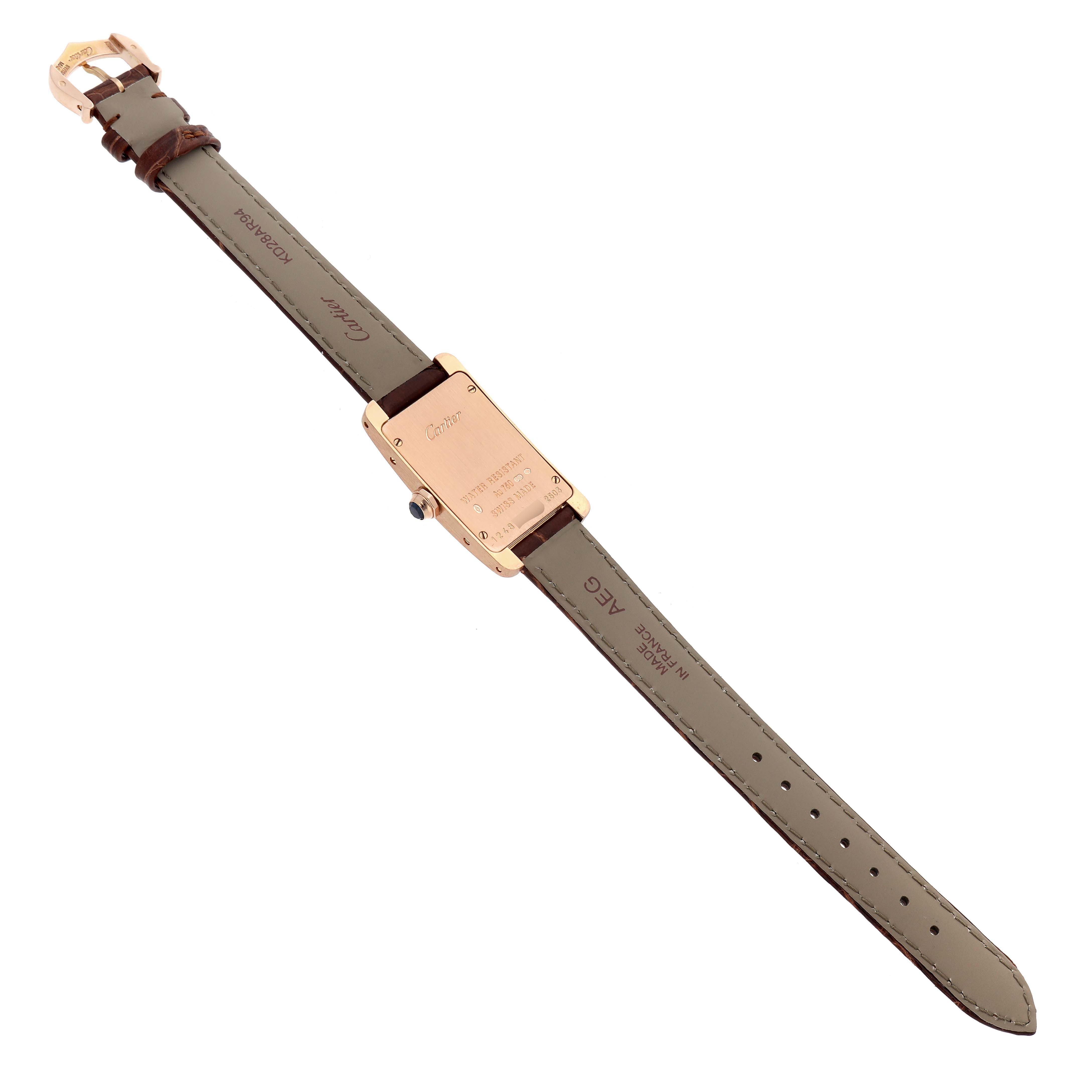 The image shows the back view of the Cartier Tank Américaine watch, highlighting the case back, strap, and buckle.