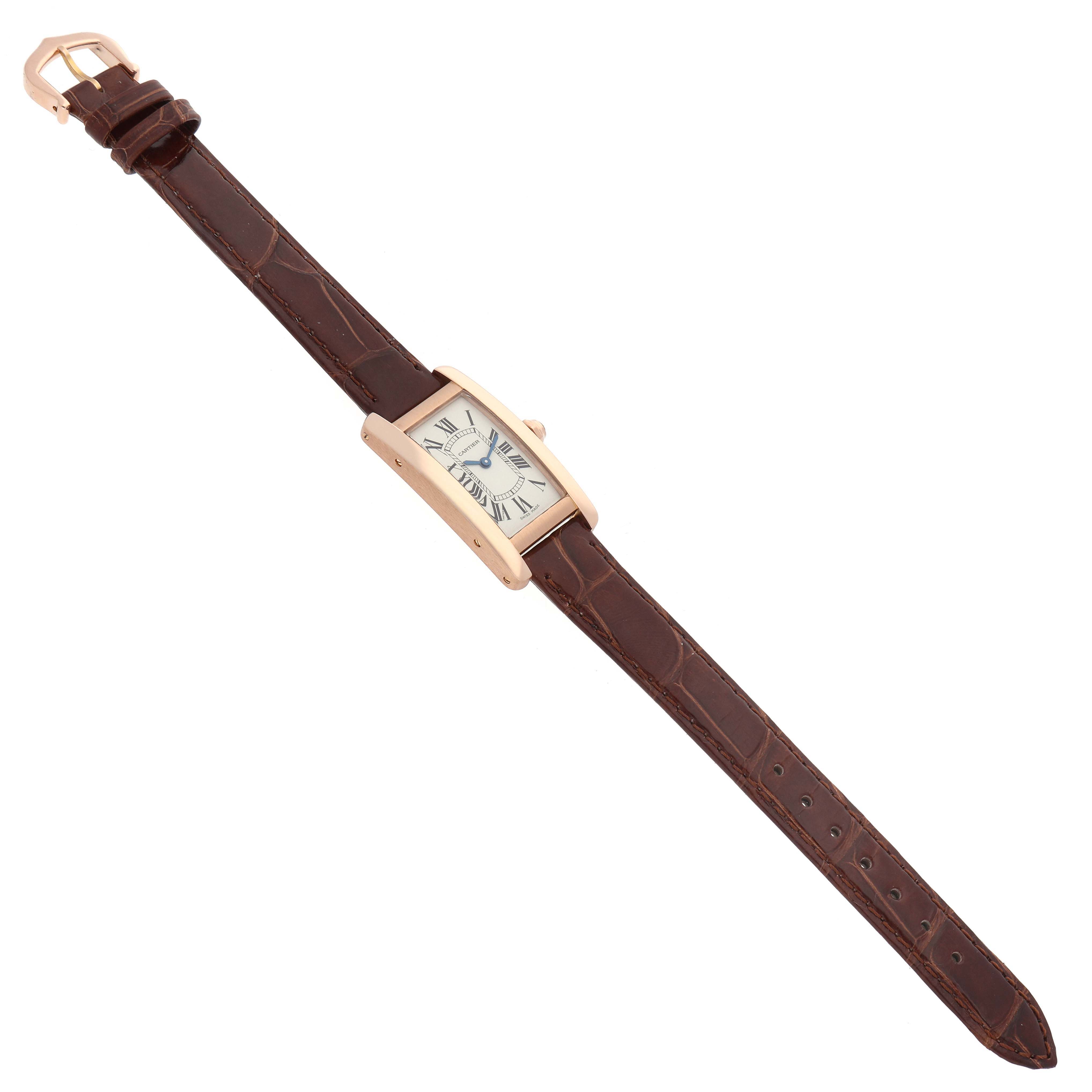 The image shows a Cartier Tank Americaine W2607456 Women's Rose Gold Silver Dial watch from a top-down angle, highlighting the face, case, crown, and full brown strap.
