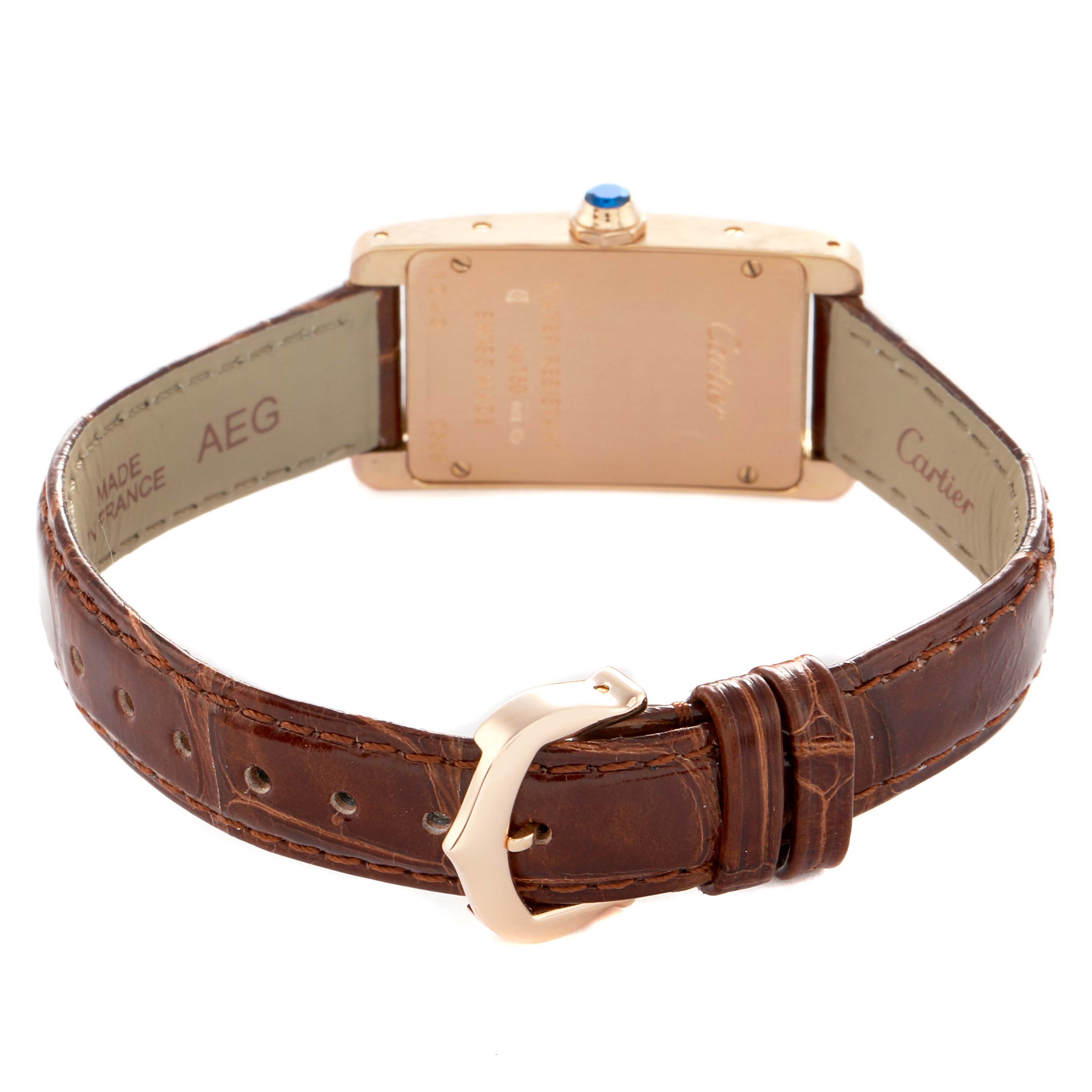 The image shows the back of a Cartier Tank Americaine W2607456 Women's Rose Gold Silver Dial watch, featuring the case back, strap, and buckle.