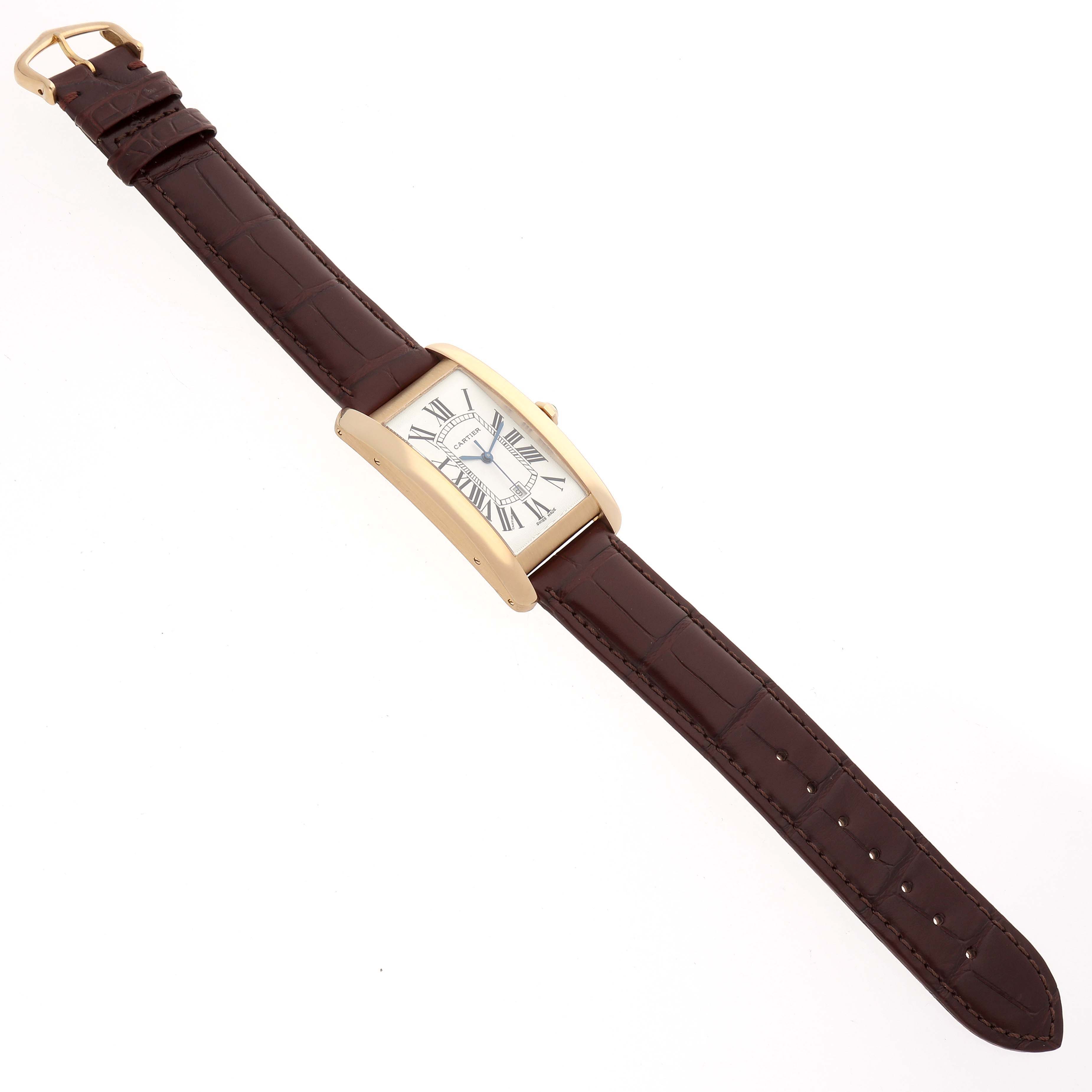 The Cartier Tank Americaine W2603156 Men's Yellow Gold Silver Dial watch is shown from a top view, displaying the entire brown strap and rectangular case with Roman numeral dial.