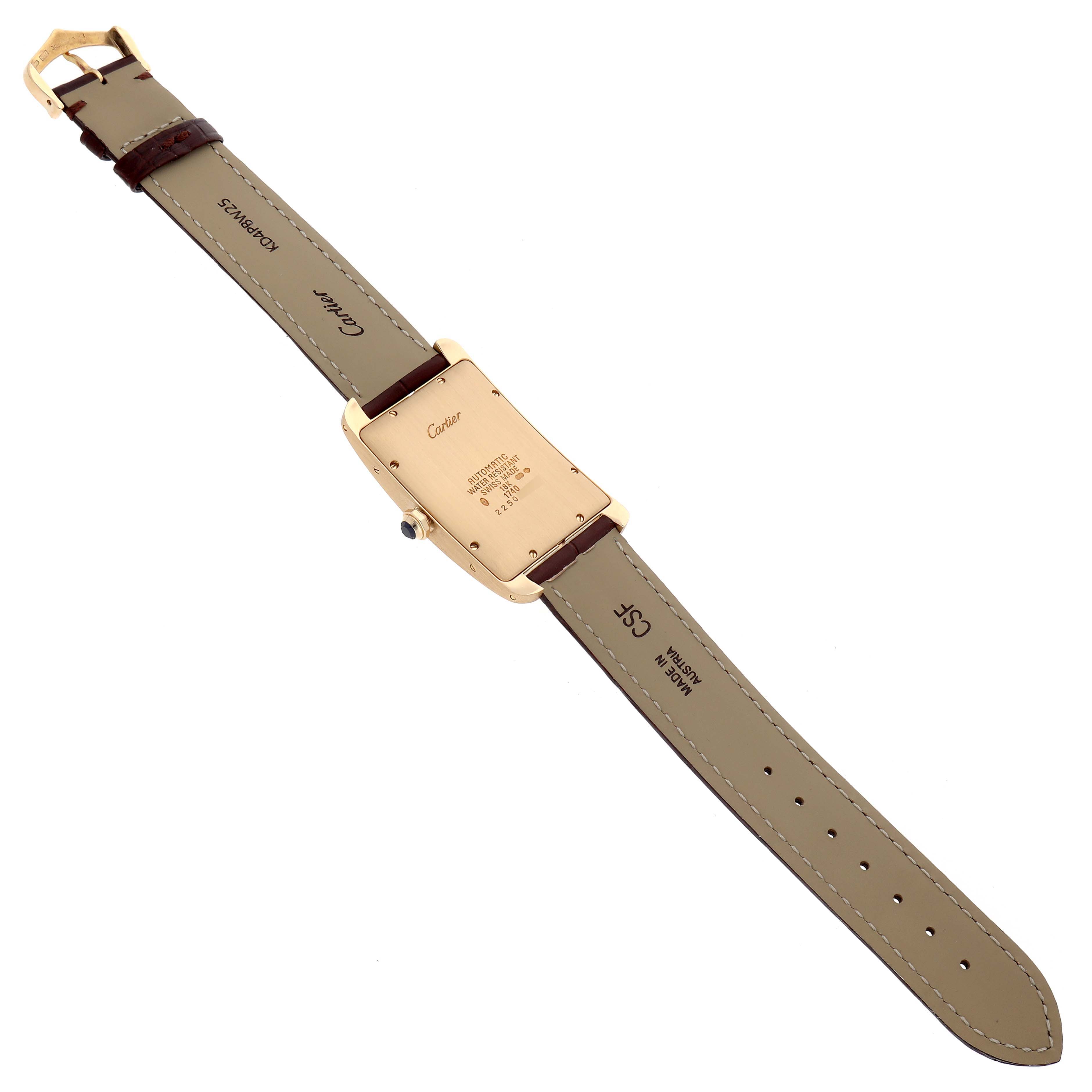 The image shows the back of the Cartier Tank Americaine W2603156 Men's Yellow Gold Silver Dial watch with a full view of the strap and buckle.