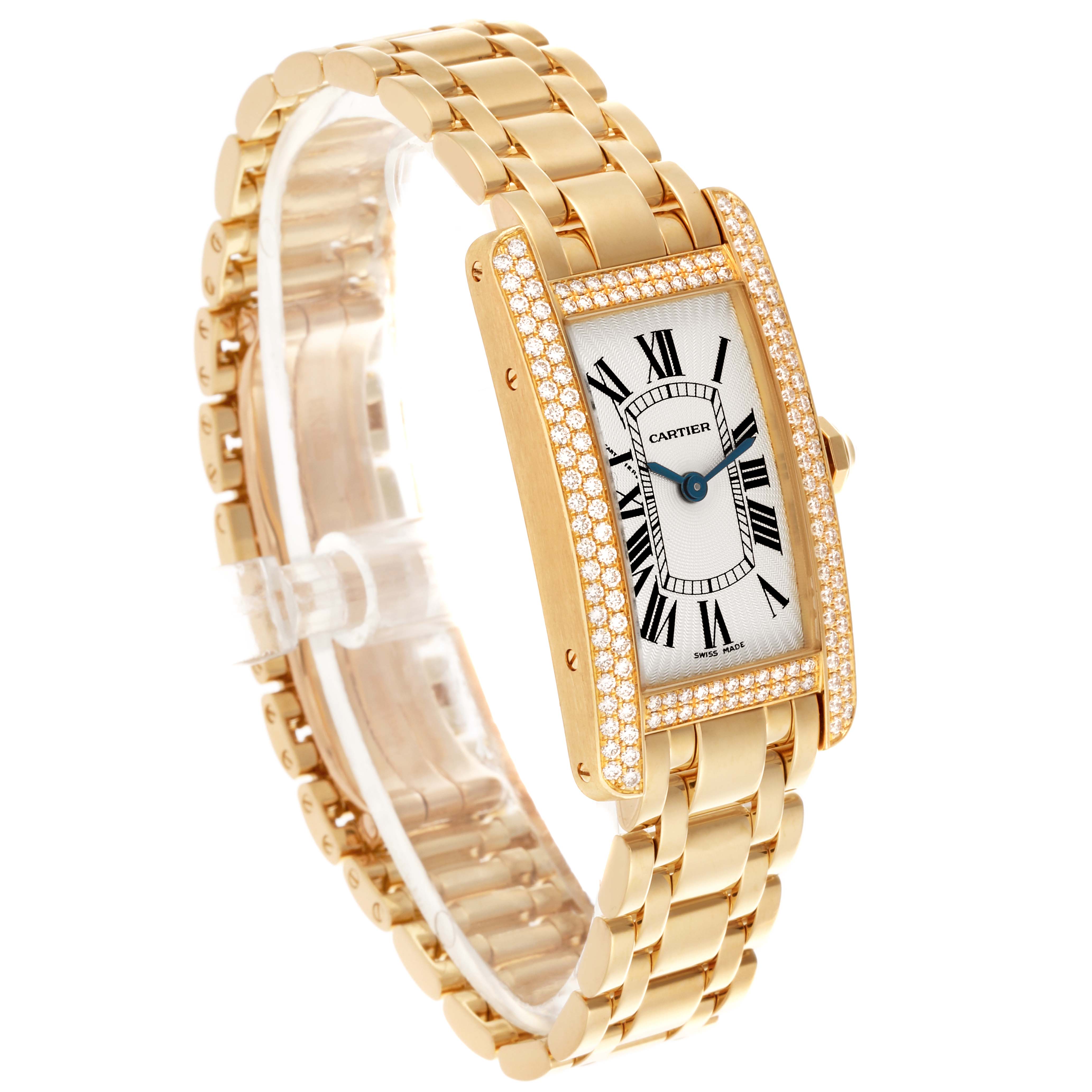 The Cartier Tank Americaine WB7012K2 Women's Yellow Gold Silver Dial WB7012K2 Women's Yellow Gold Silver Dial watch is shown at a three-quarter angle, displaying its gold case, diamond bezel, and bracelet.