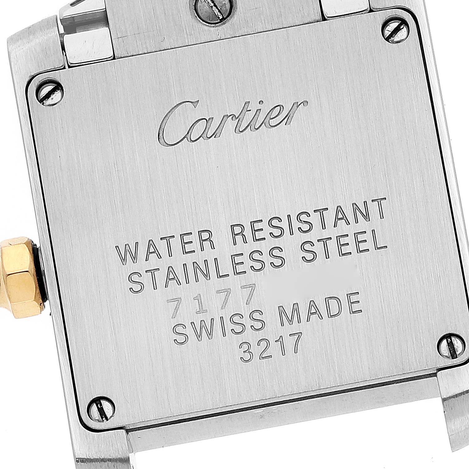 This image shows the back case of a Cartier Tank Francaise W51007Q4 Women's Steel and Gold (two tone) Silver Dial W51007Q4 Women's Steel and Gold (two tone) Silver Dial watch, highlighting its stainless steel material and serial numbers.