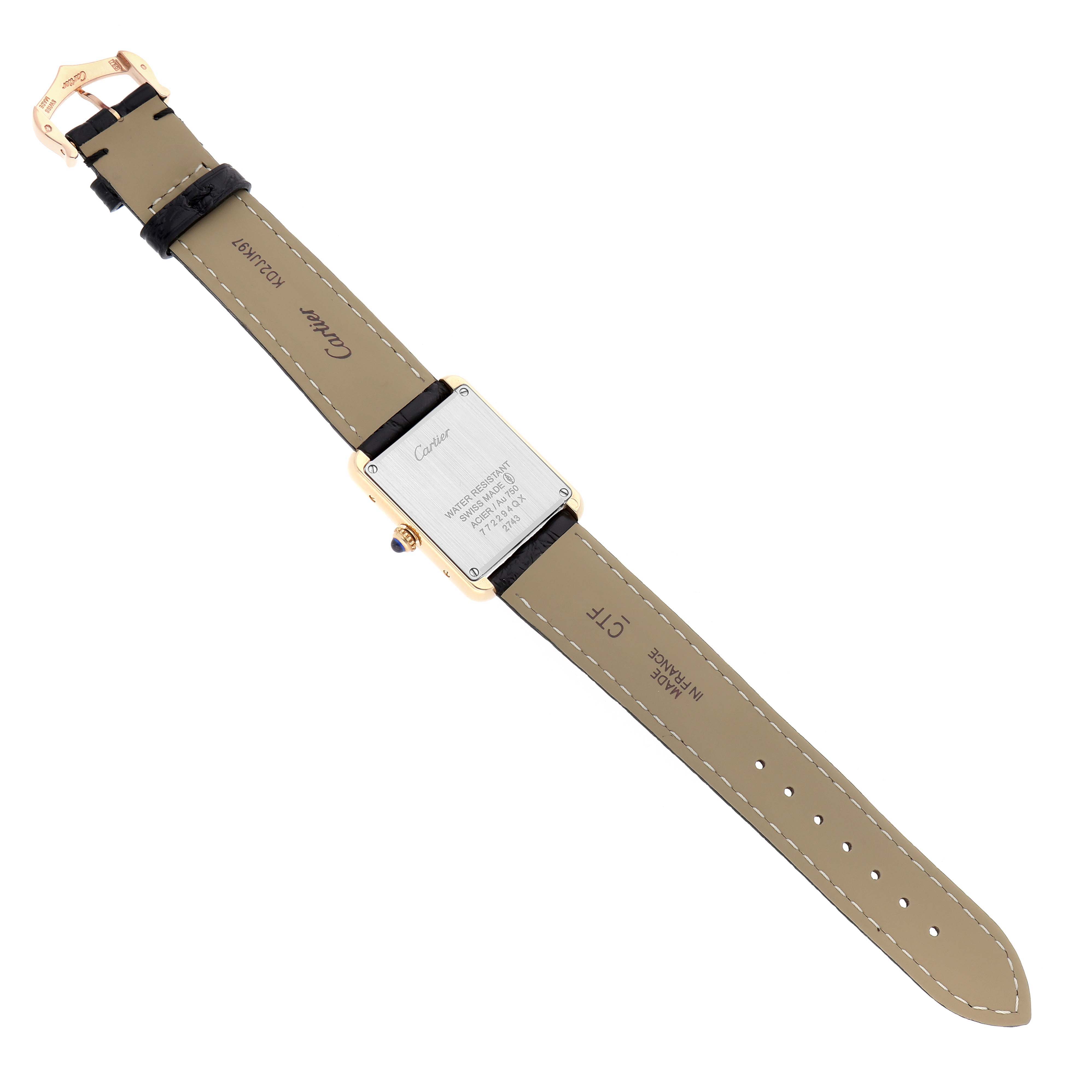 The Cartier Tank Solo W1018755 Women's Yellow Gold Silver Dial watch is shown from the back, displaying the case back, strap, and buckle.