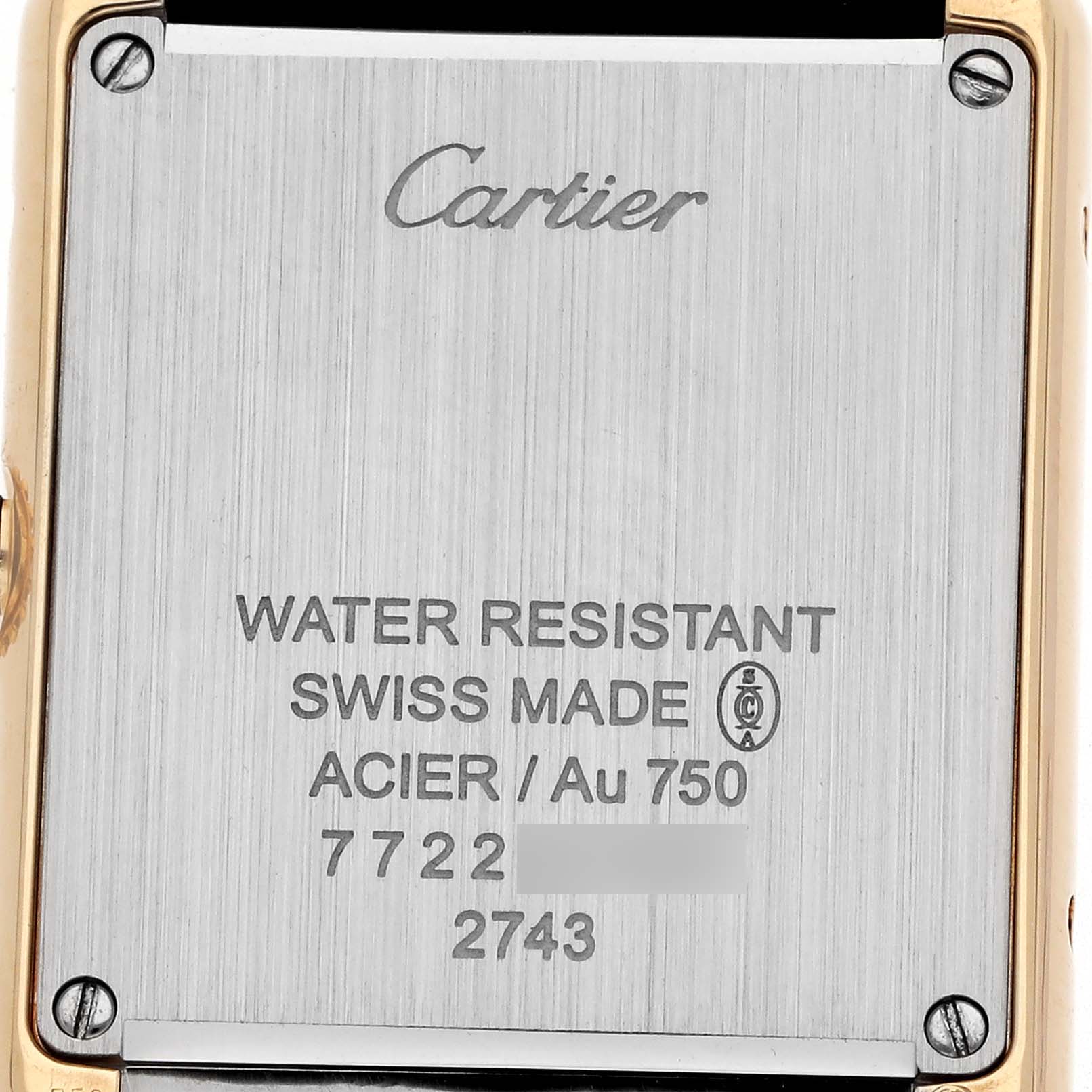 The image shows the back case of the Cartier Tank Solo W1018755 Women's Yellow Gold Silver Dial watch, displaying branding and water resistance details.