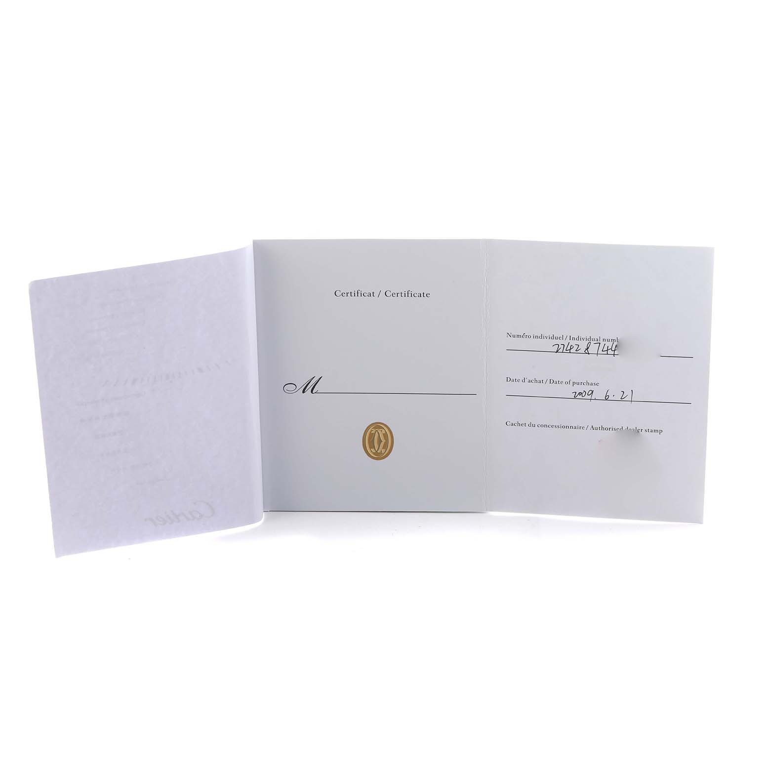 The image shows the certificate booklet for the Cartier Tank Solo W1018855 Men's Yellow Gold Silver Dial watch, open to display the interior pages with purchase details.