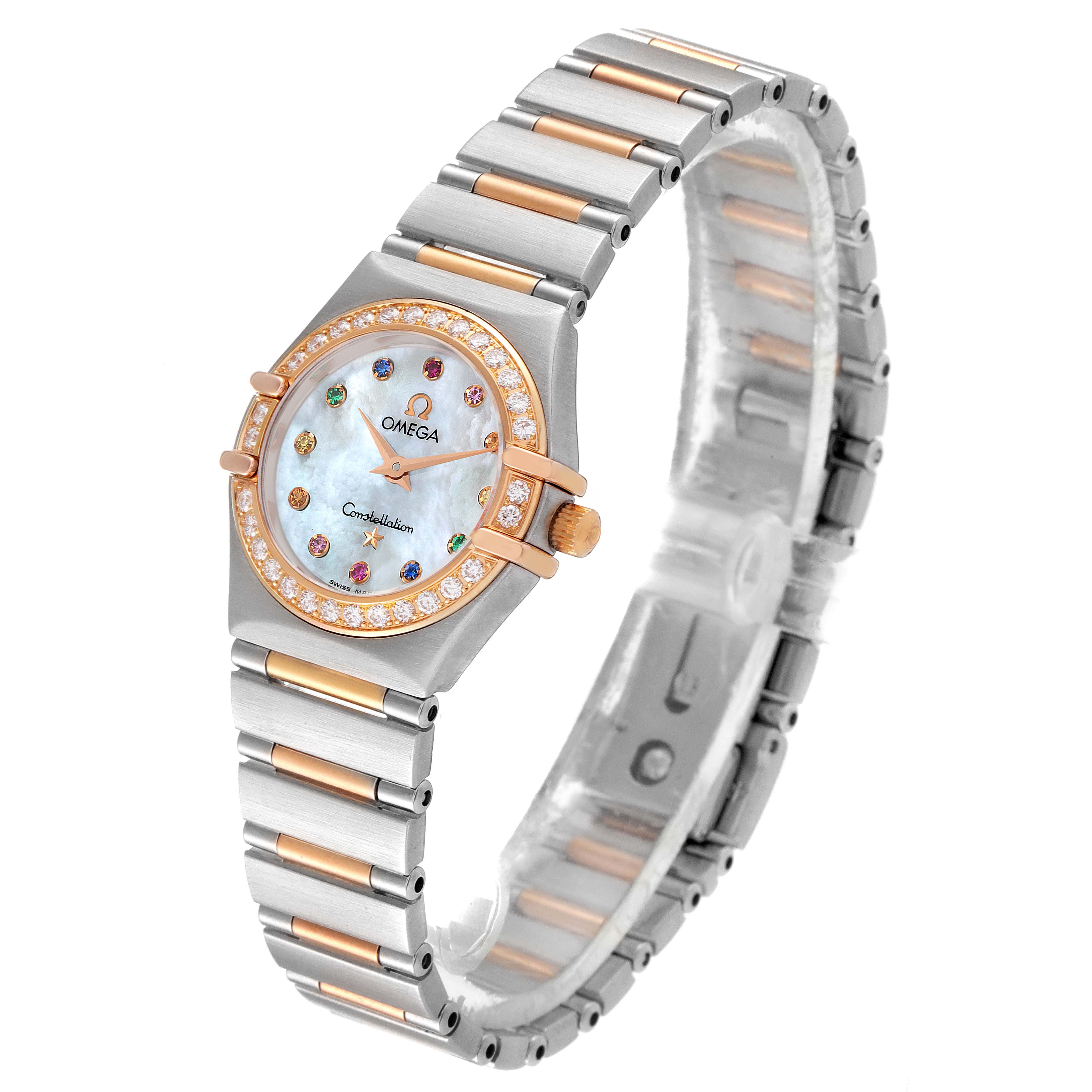 This Omega 1365.79.00 Women
s Steel and Gold (two tone) Mother of Pearl Dial 1365.79.00 Women
s Steel and Gold (two tone) Mother of Pearl Dial Constellation Iris Steel Rose Gold Multi Stone Ladies Watch 1365.79.00 is shown at a three-quarter angle, highlighting its bracelet, face, and bezel.