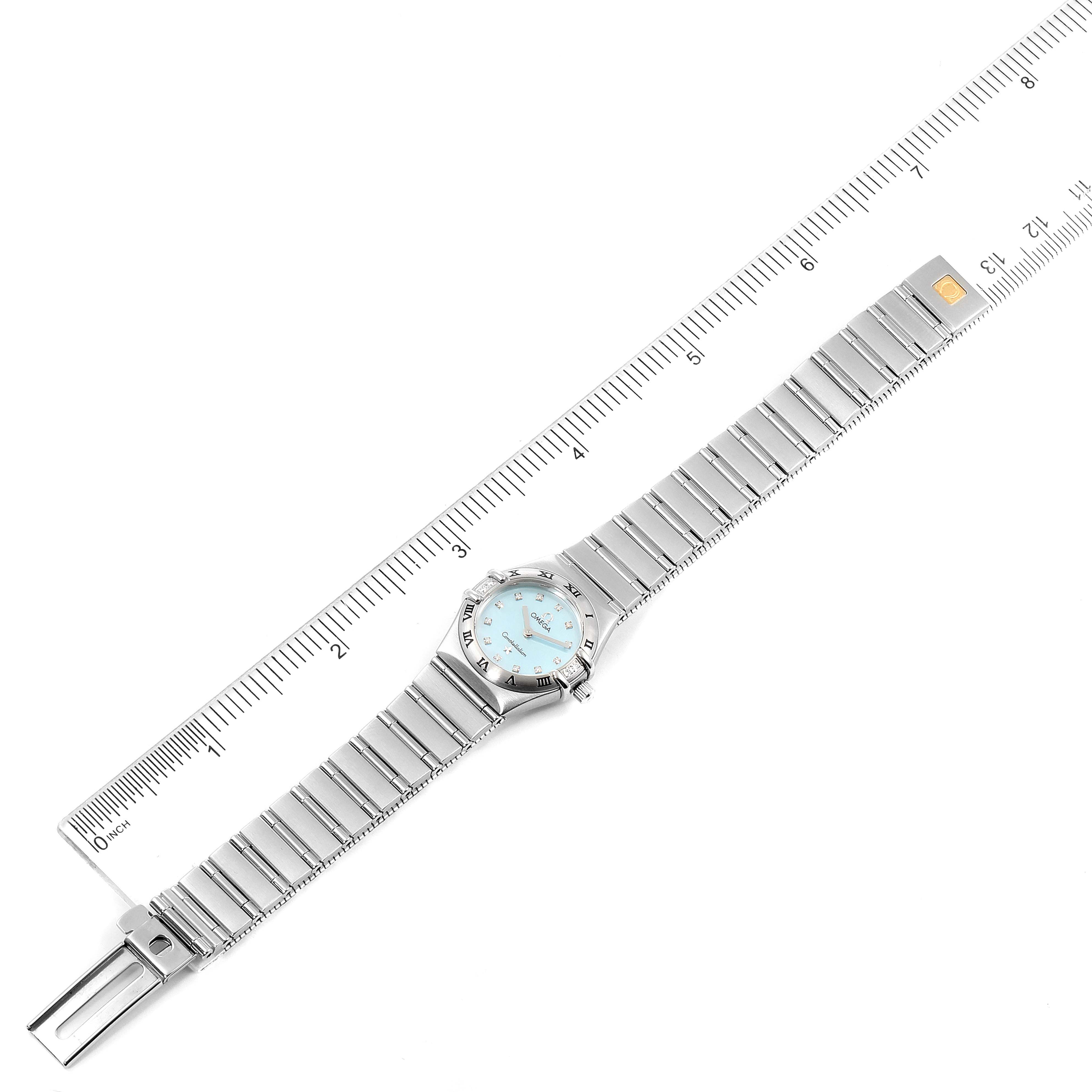 The Omega 1567.86.00 Women
s Stainless Steel Mother of Pearl Dial 1567.86.00 Women
s Stainless Steel Mother of Pearl Dial Constellation Mini Blue MOP Diamonds Ladies Watch 1567.86.00 model is shown fully extended with a ruler for measurement.
