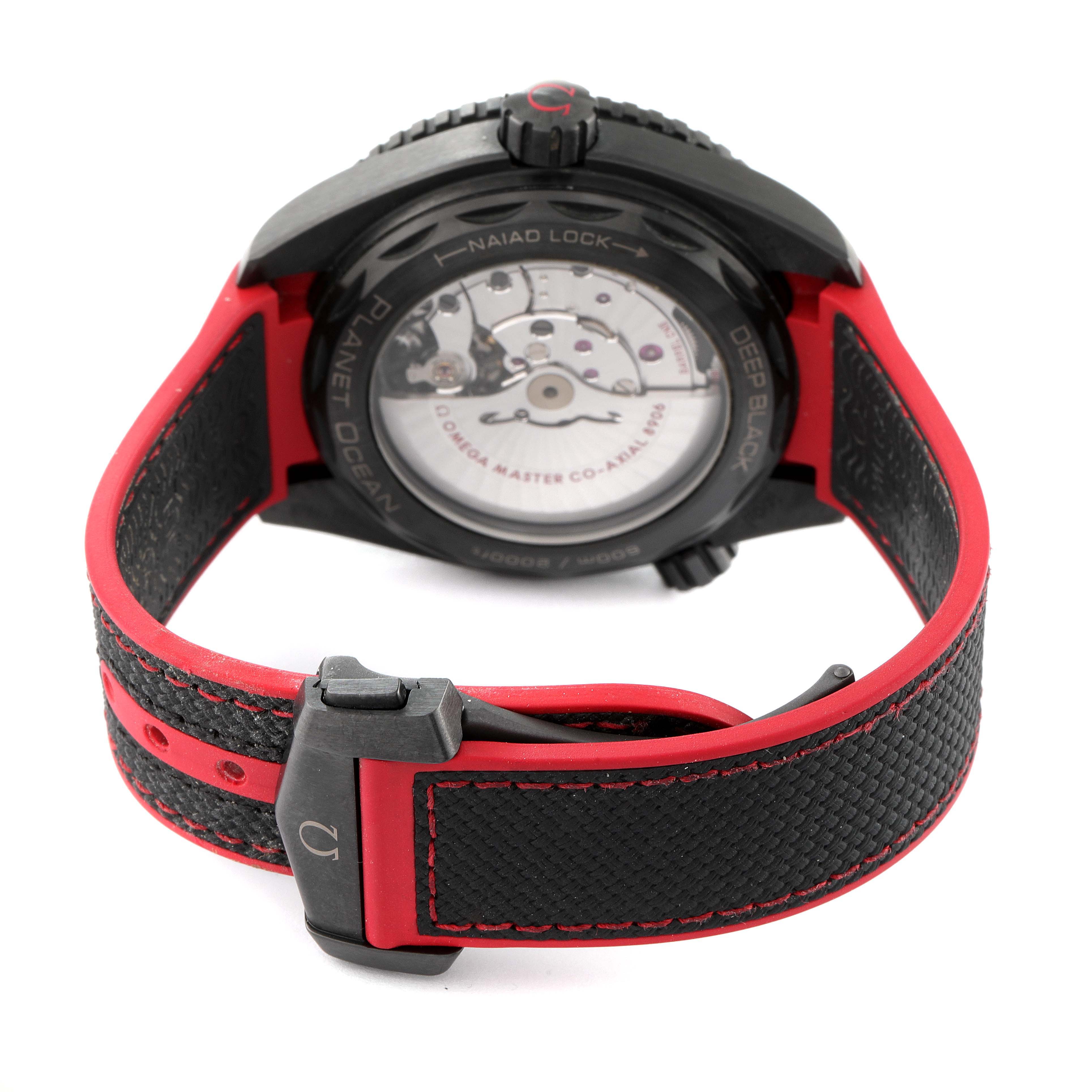 The image shows the back view of the Omega Planet Ocean 215.92.46.22.01.003 Men's Ceramic Black Dial 215.92.46.22.01.003 Men's Ceramic Black Dial watch, highlighting the case back, strap, and clasp.