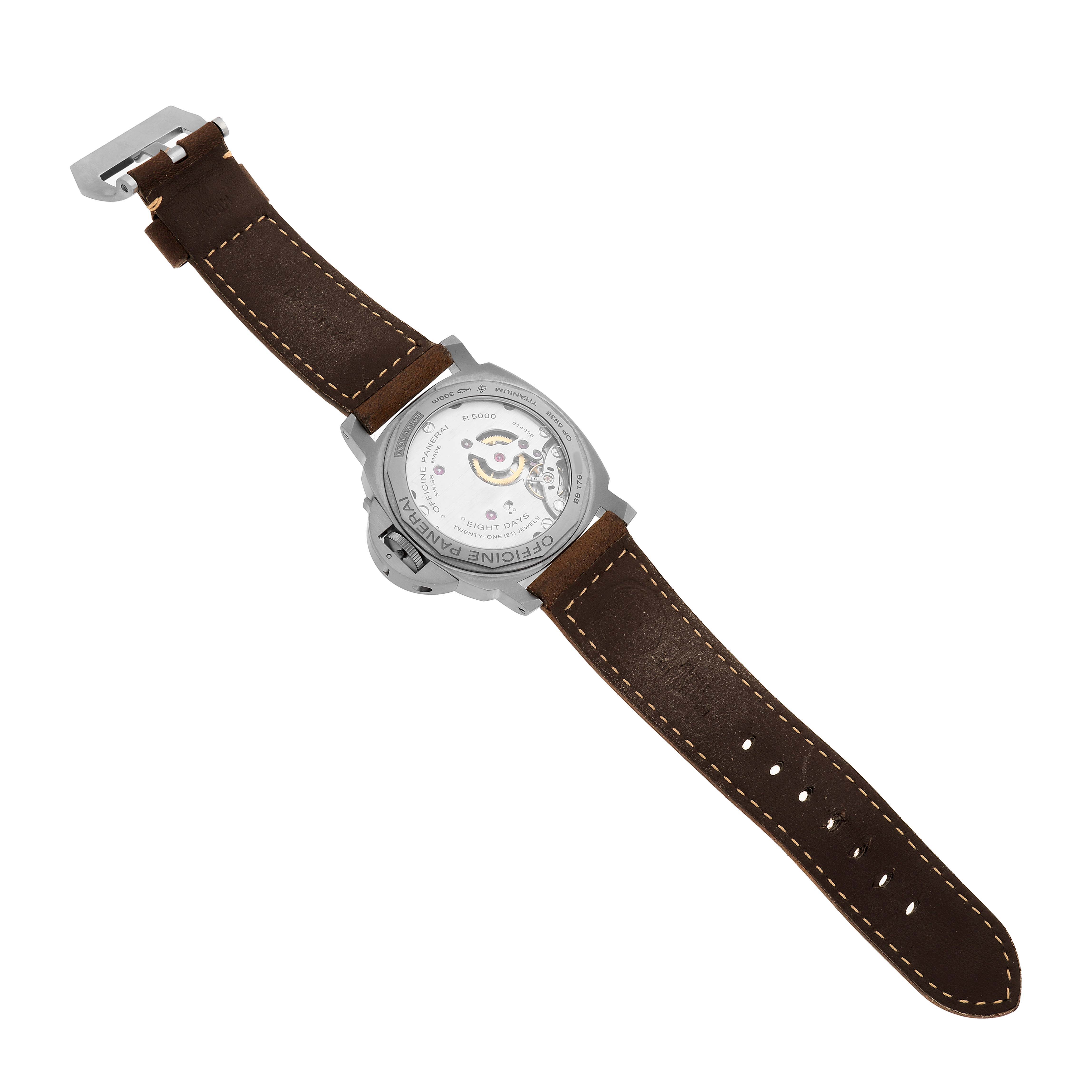 The Panerai Luminor PAM00564 Men's Titanium Black Dial watch is shown from the back, displaying its transparent case back and brown leather strap.