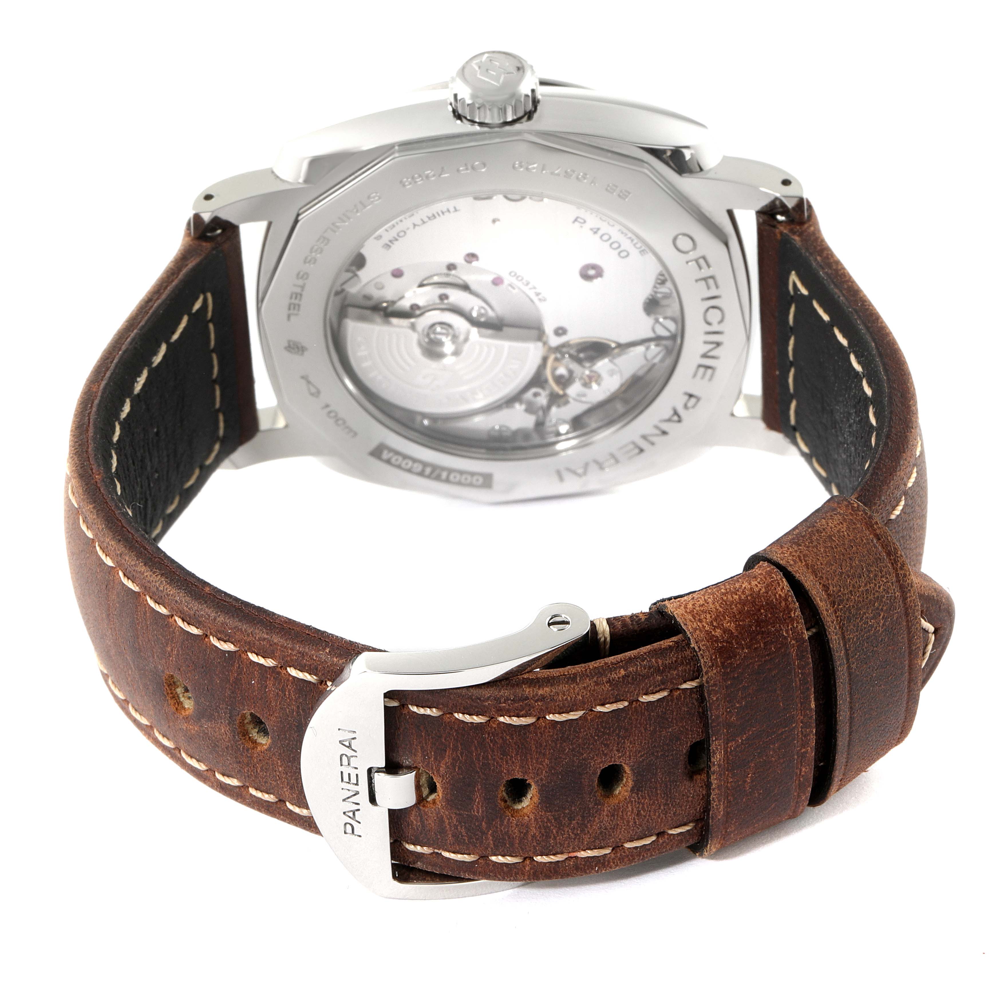 The image shows the back view of a Panerai Radiomir PAM00995 Men
s Stainless Steel Green Dial PAM00995 Men
s Stainless Steel Green Dial watch, focusing on its case back, movement, and brown leather strap.