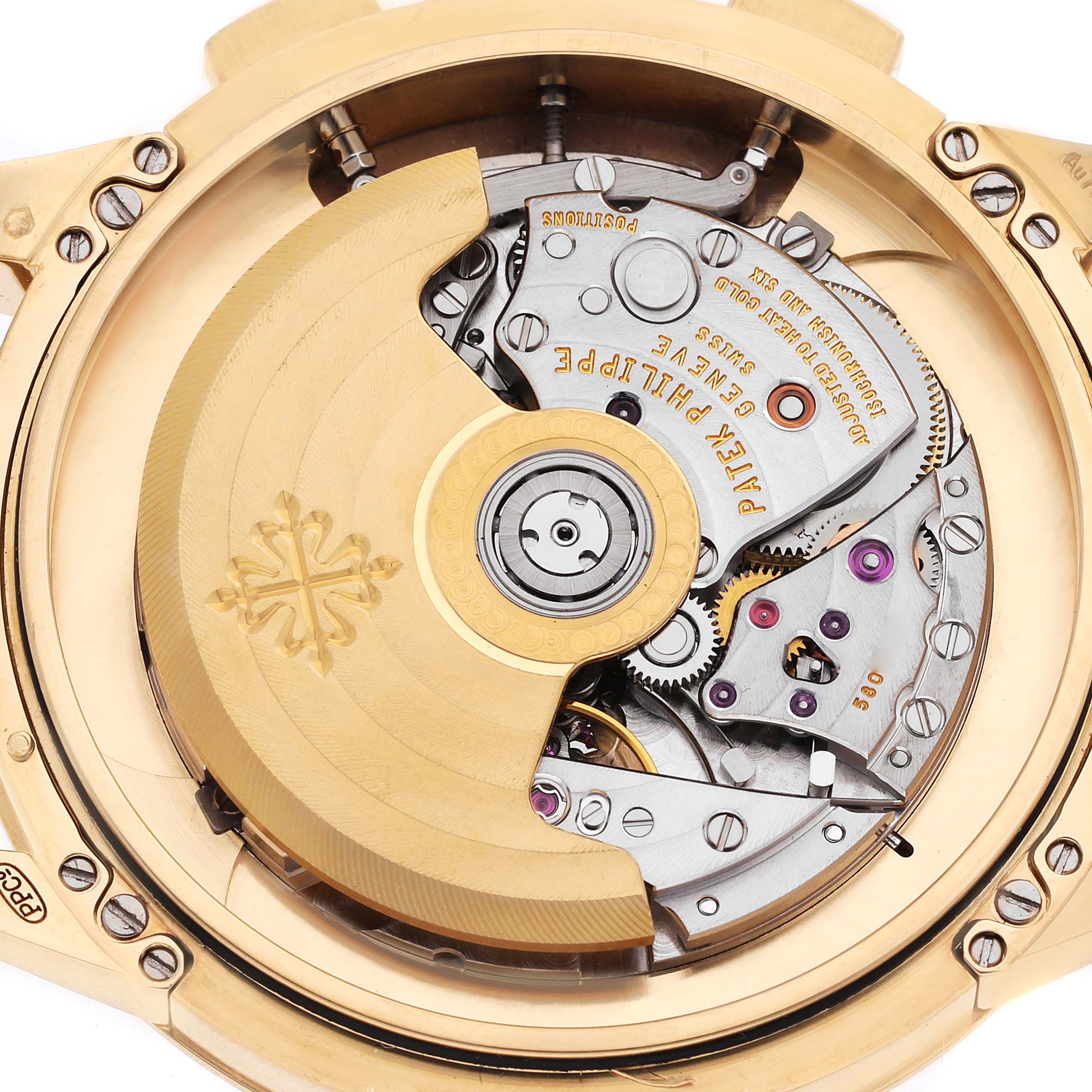 The image shows the back of a Patek Philippe Complications 5975J-001 Men's Yellow Gold Silver Dial watch, revealing its intricate movement and rotor.