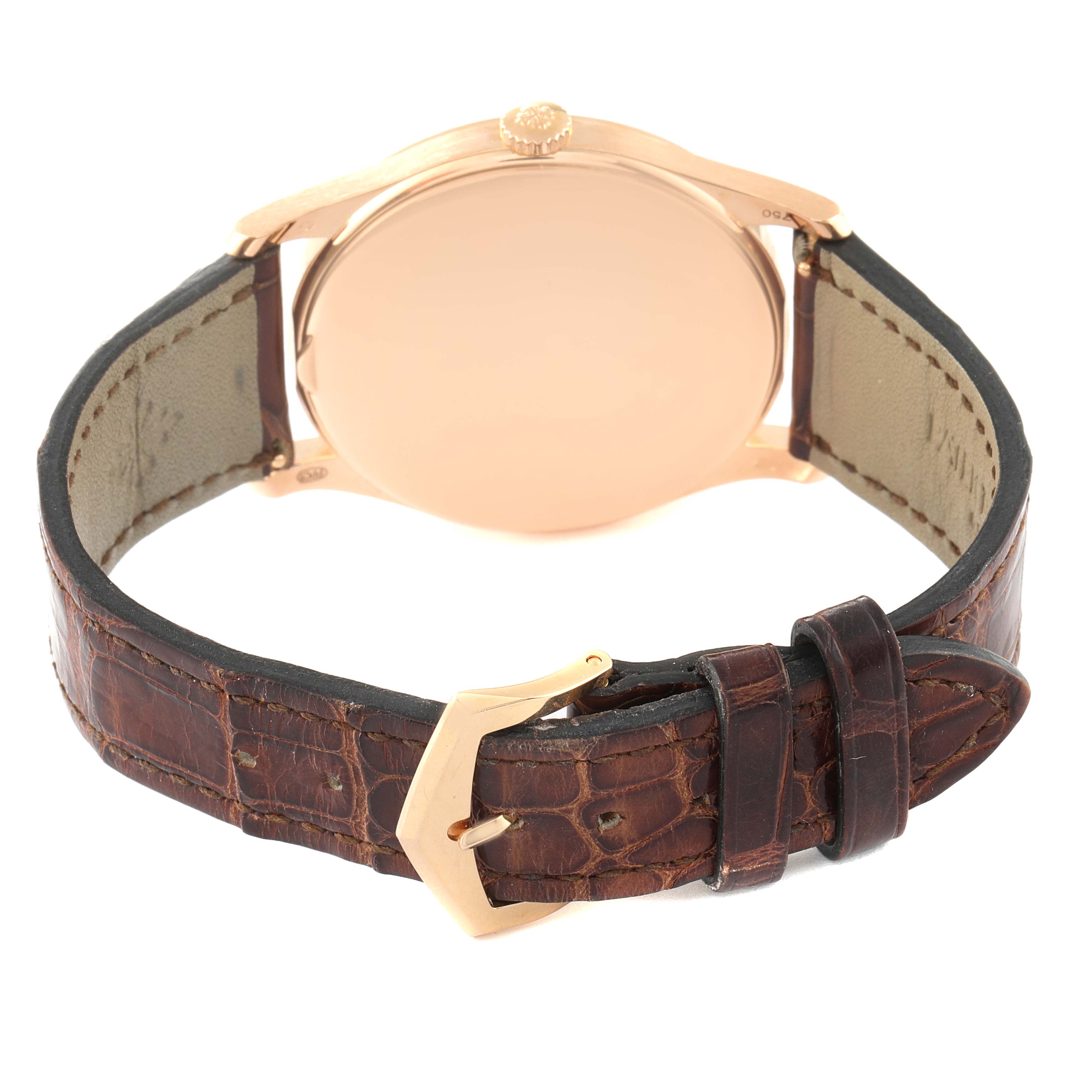 The image shows the back view of a Patek Philippe Calatrava 5196R Men's Rose Gold Silver Dial 5196R Men's Rose Gold Silver Dial watch with a brown leather strap and gold buckle.