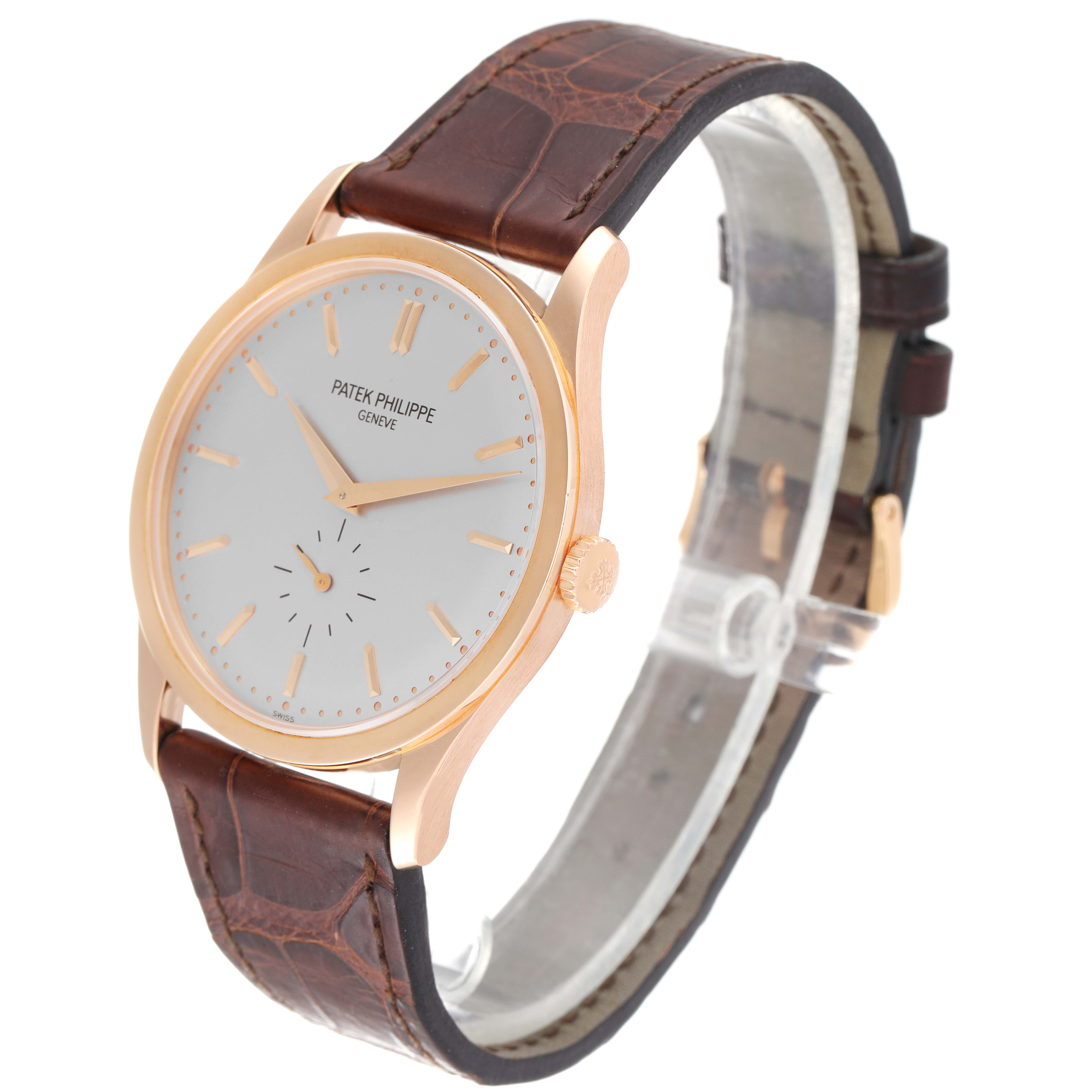 The image shows a Patek Philippe Calatrava 5196R Men's Rose Gold Silver Dial 5196R Men's Rose Gold Silver Dial watch at a three-quarter angle displaying the face, crown, and leather strap.