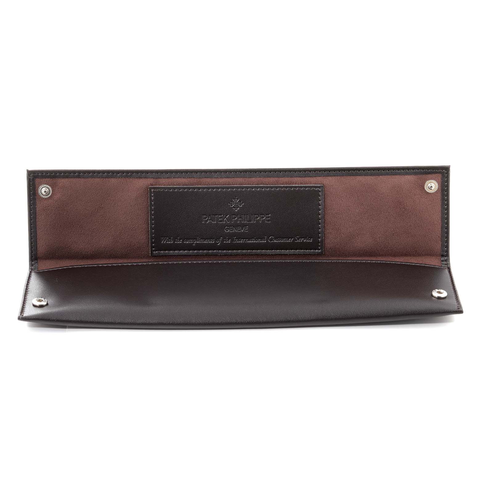The image shows an open brown and black leather watch pouch for the Patek Philippe Calatrava 5196R Men's Rose Gold Silver Dial 5196R Men's Rose Gold Silver Dial model.