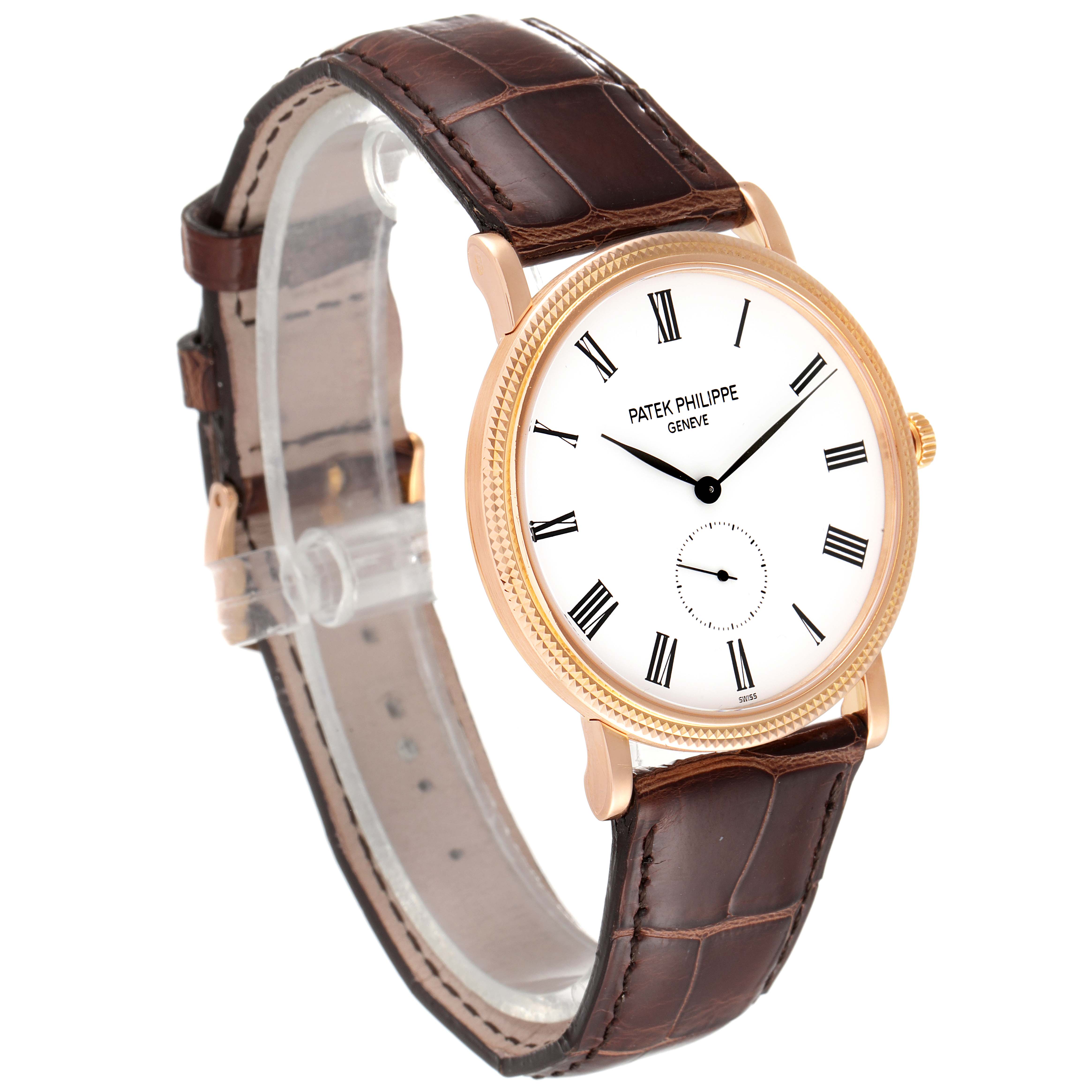 The image shows a Patek Philippe Calatrava 5119R Men
s Rose Gold White Dial 5119R Men
s Rose Gold White Dial watch at a front-left angle, showcasing its dial, case, and brown leather strap.