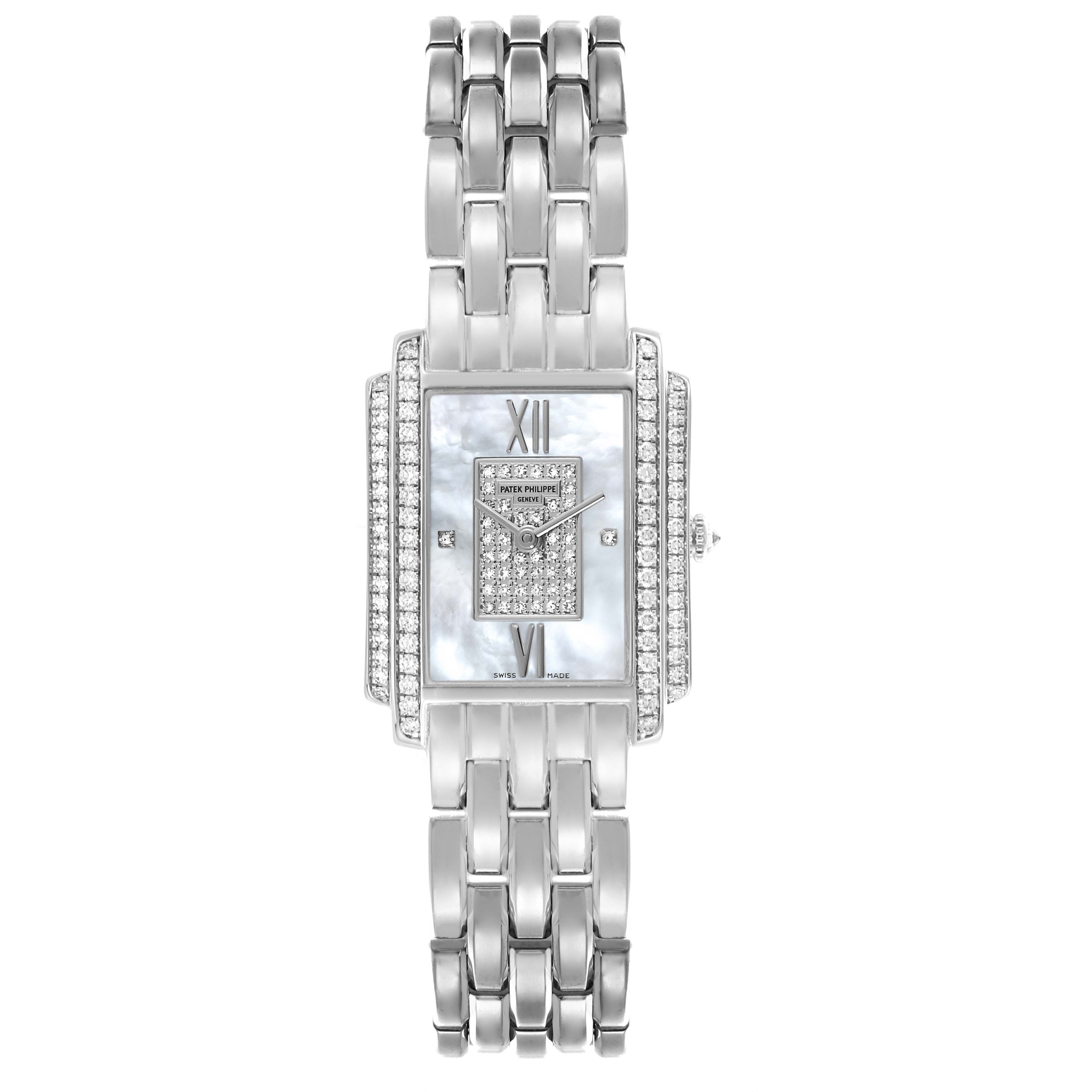 The Patek Philippe Gondolo 4825G Women
s White Gold Mother of Pearl Dial 4825G Women
s White Gold Mother of Pearl Dial watch is shown from the front, displaying its rectangular dial, diamond embellishments, and metal bracelet.
